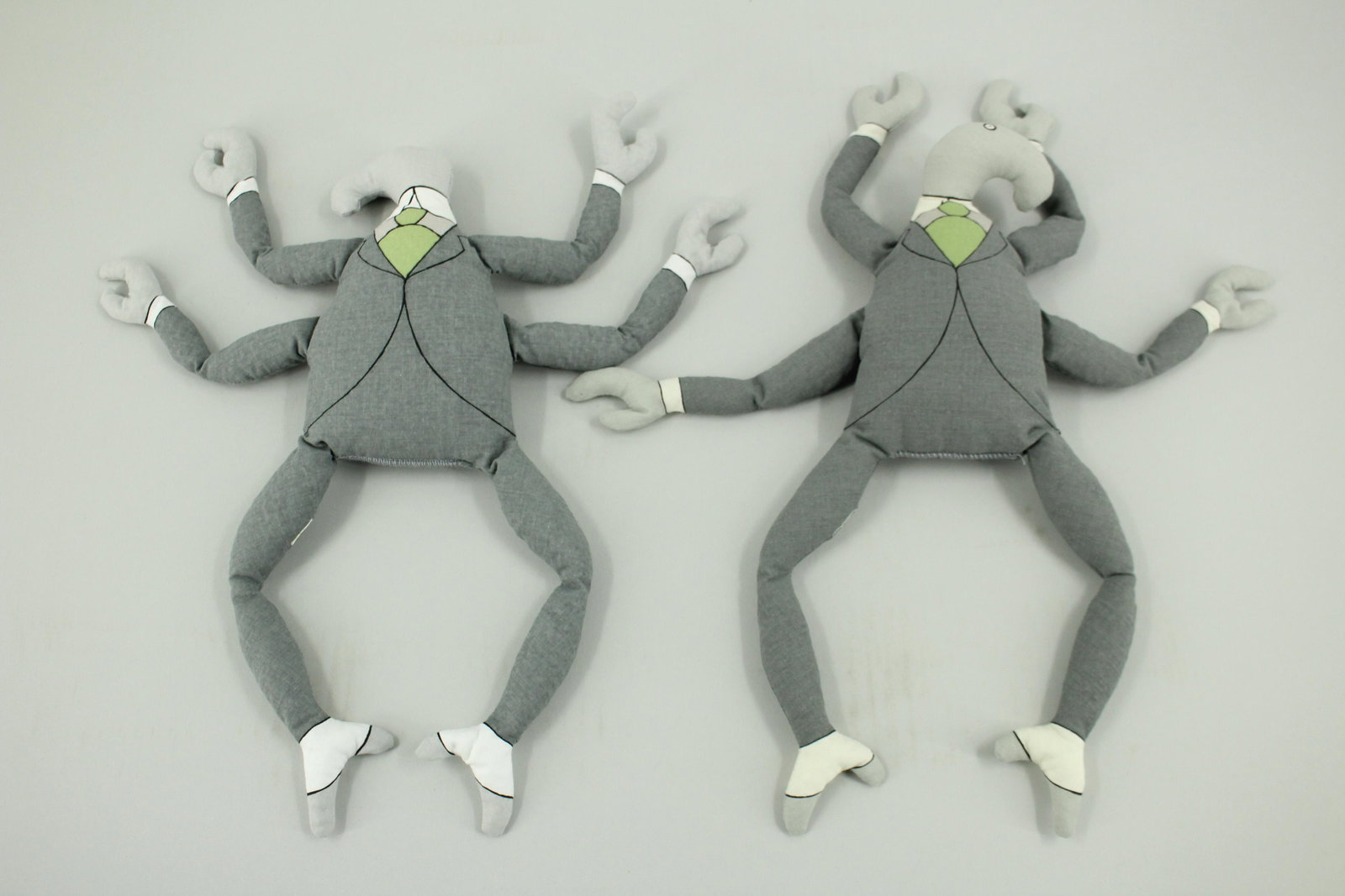 Pair of Bah Humbug Bean Bag Characters: Pair of Bah Humbug Bean Bag Characters, one right facing, and one left facing. These were made to accompany The Headless Bust, a limited amount of 776 copies. Legs stamped copyright 2000 Edward Gorey.