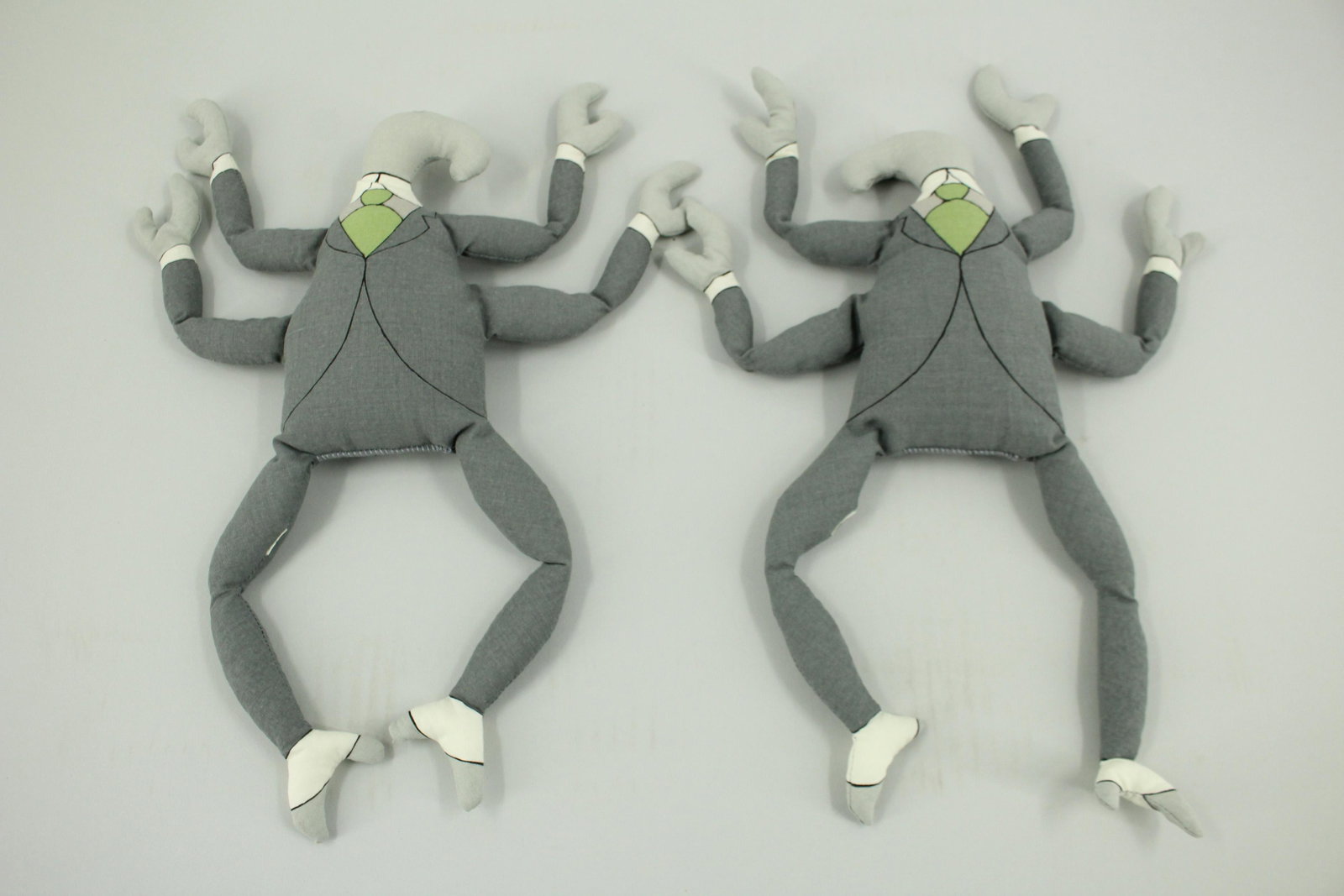 Pair of Bah Humbug Bean Bag Characters: Pair of Bah Humbug Bean Bag Characters, one right facing, and one left facing. These were made to accompany The Headless Bust, a limited amount of 776 copies. Legs stamped copyright 2000 Edward Gorey.