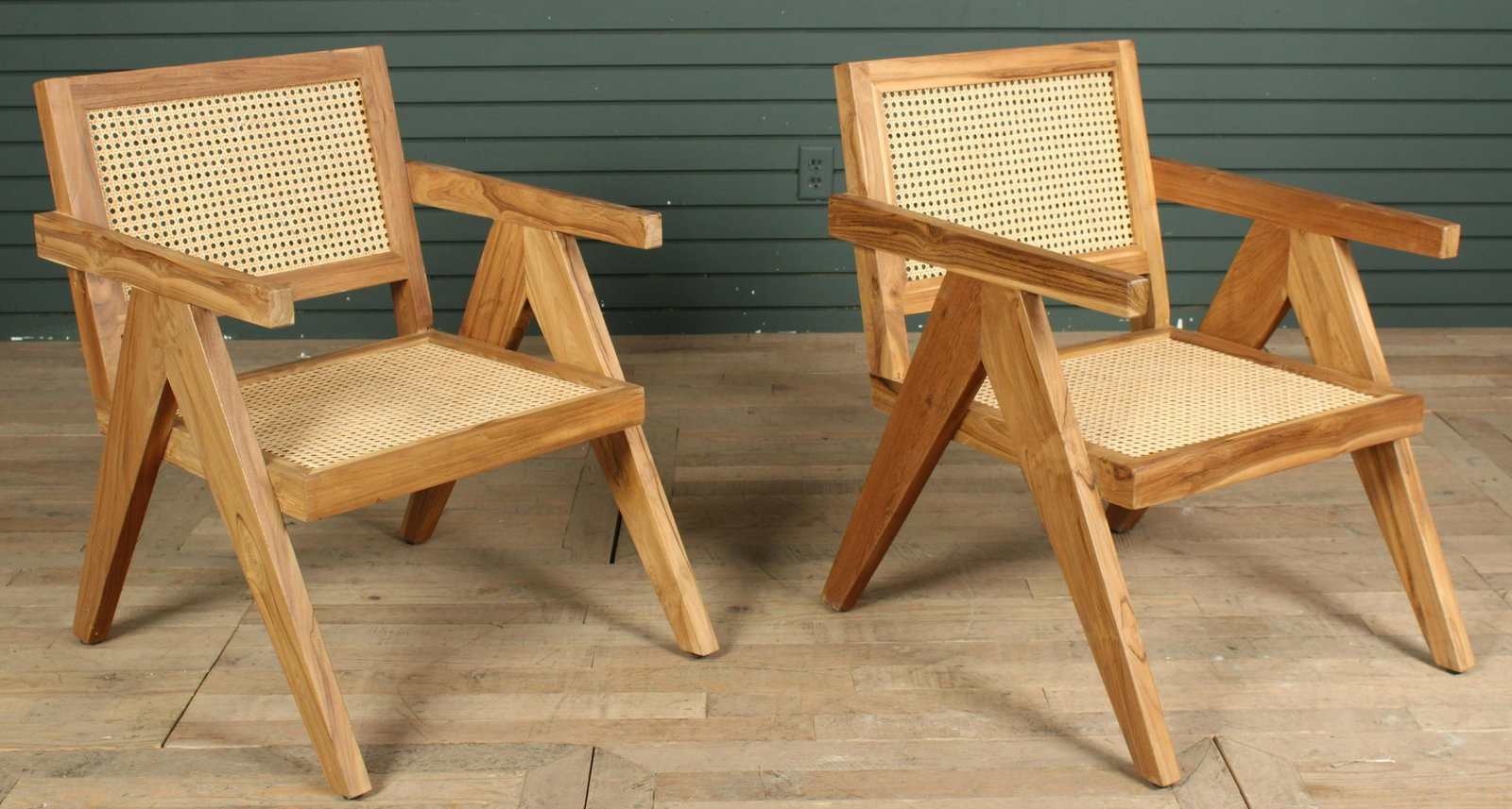 Pair of Pierre Jenneret Style Arm Chairs: A pair of Pierre Jenneret style arm chairs having carved back and seats. Size: 31"H x 23"W x 27"D