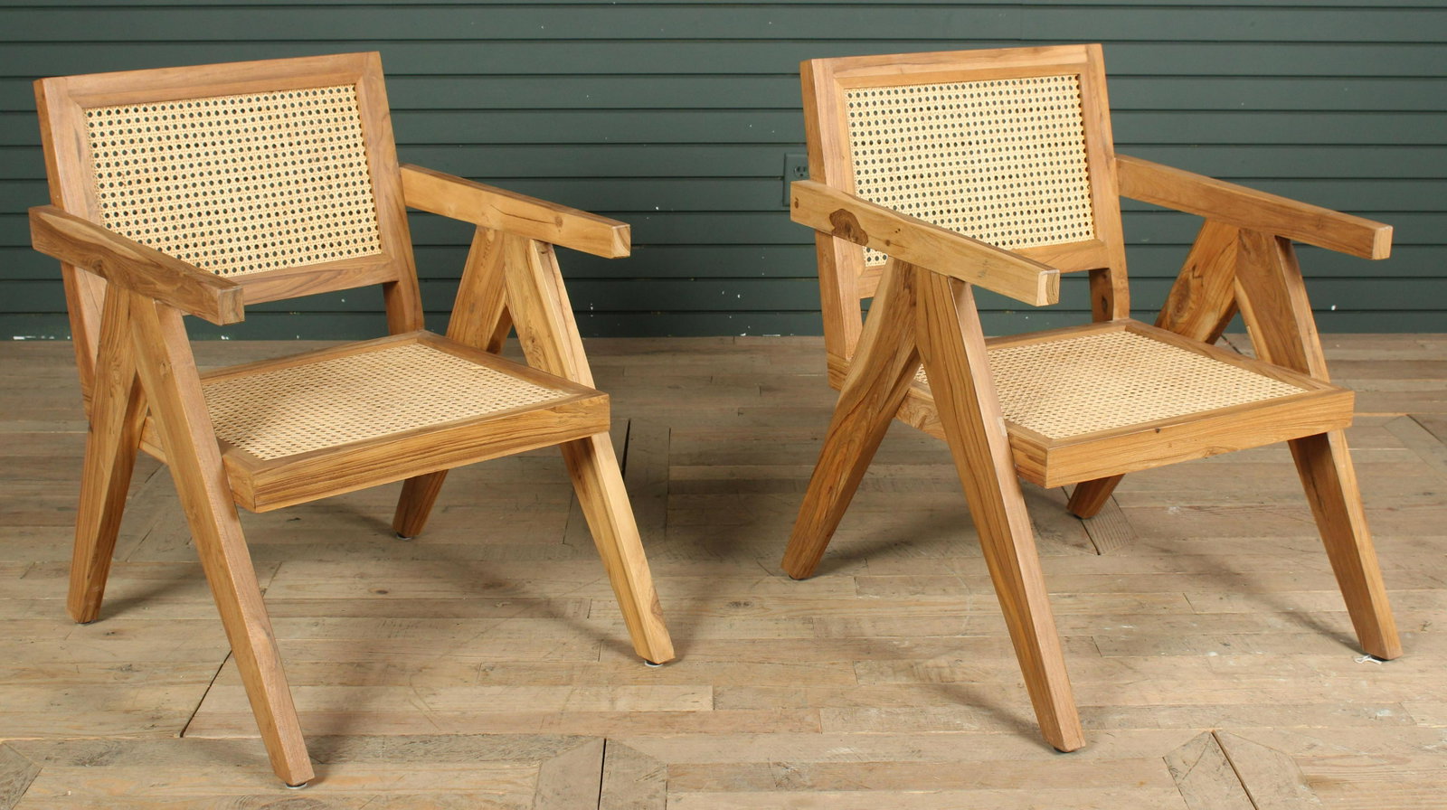 Pair of Pierre Jenneret Style Arm Chairs: A pair of Pierre Jenneret style arm chairs having carved back and seats. Size: 31"H x 23"W x 27"D