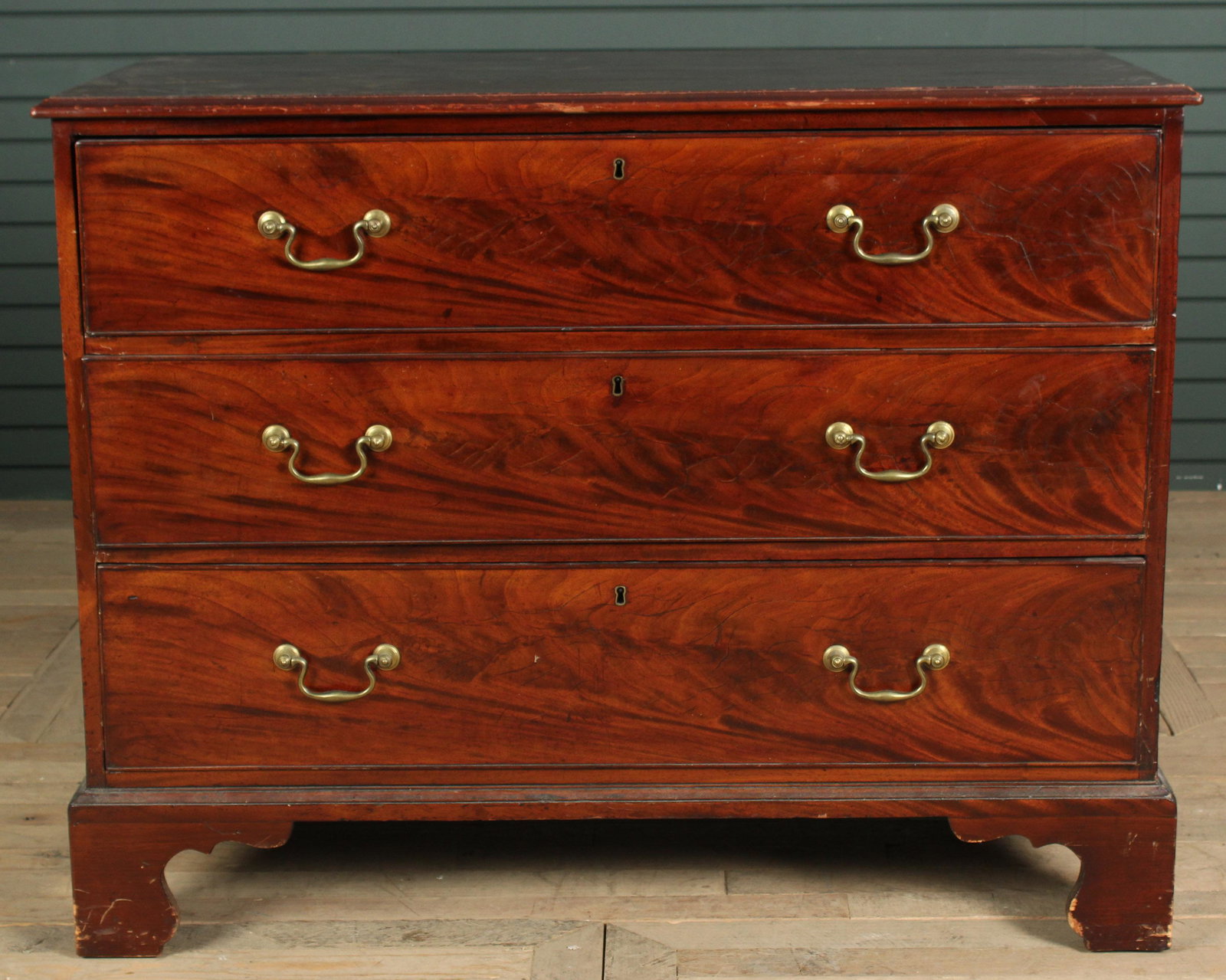 English Mahogany Chest of Drawers: English George III style mahogany chest having three drawers and bracket feet. Size: 36.5" H x 46" W x 22.5" D