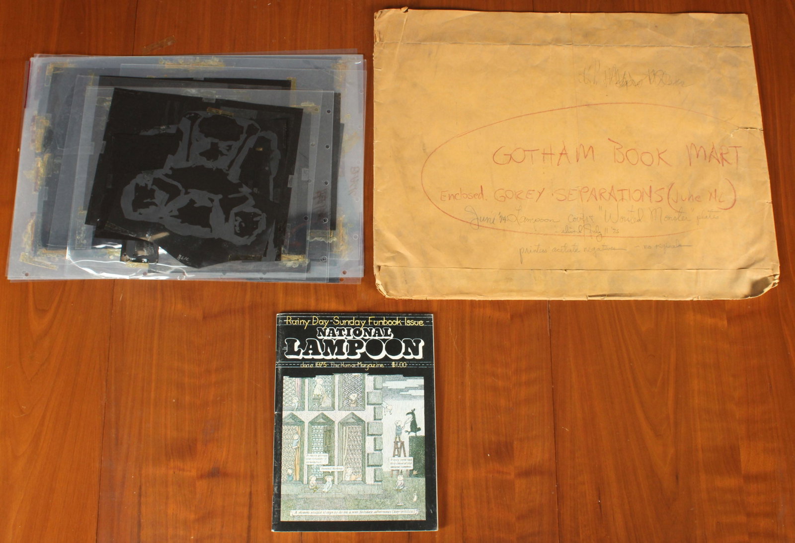 1975 National Lampoon Rainy Day Sunday Funbook: 1975 National Lampoon Rainy Day Sunday Funbook. Illustrated by Edward Gorey. Includes sample issue and color separation photo mechanical cels. Size: Envelope: 17.25" H x 22.25" W