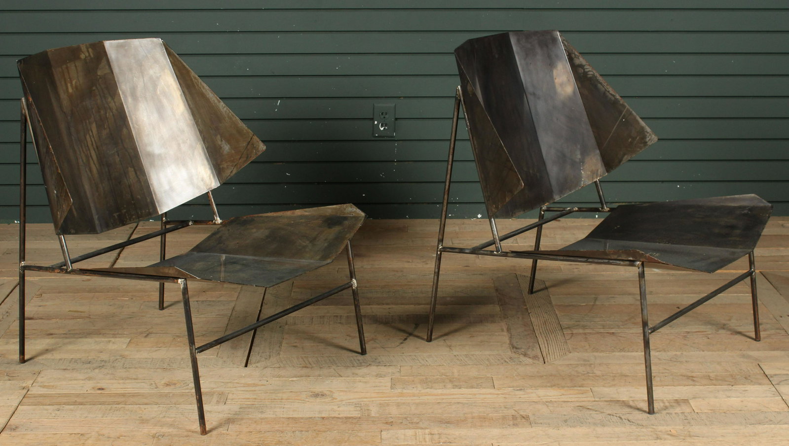 Pair Atipico Terra Chairs: A good pair of labeled Atipico metal origami inspired lounge chairs. Size: 31" H x 26.5" W x 28.5" D