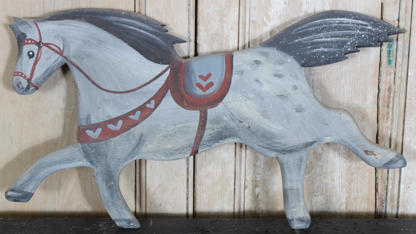 Folk Art Painted Wood Horse Applique: A painted wood horse plaque in the style of a carousel horse. Size: 15.5" H x 27.5" W x 1" D