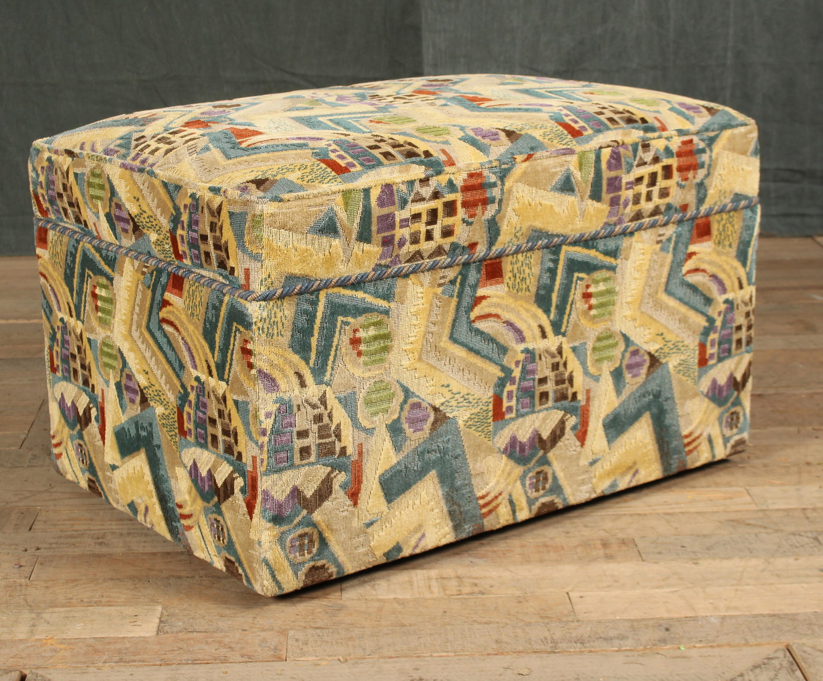 Art Deco Style Ottoman: A custom ottoman upholstered in Art Deco style cut velvet upholstery. Size: 18"H x 30"W 21"D