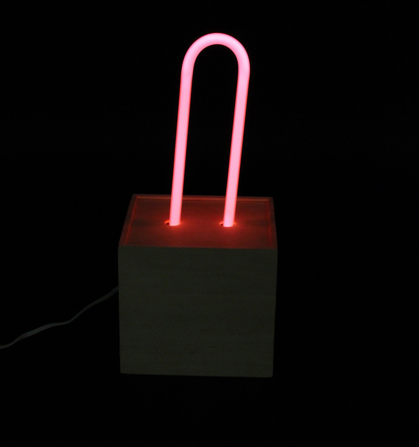 Studio Pink Neon Light Fixture- Signed: Pink Neon Light Fixture. U-Bend wooden base. Size: 14.5"H x 6.5"W x 5.5"D