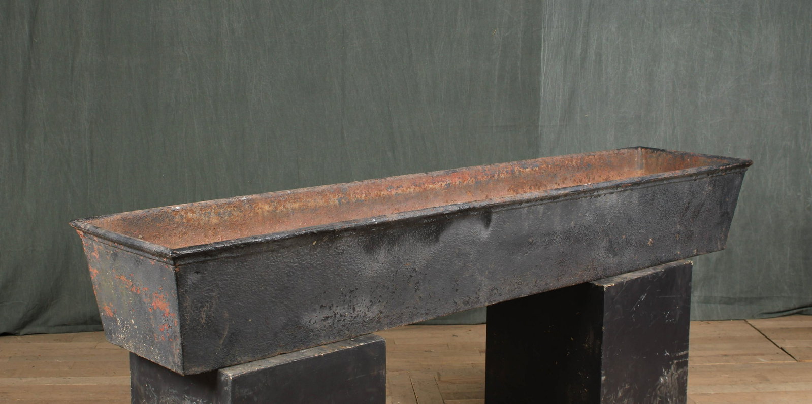 Antique 19th C Cast Iron Trough: A very good late 19th century possible Philadelphia cast iron trough having a rolled rim and rectangular form. Size: 11"H x 76"W x 16"D
