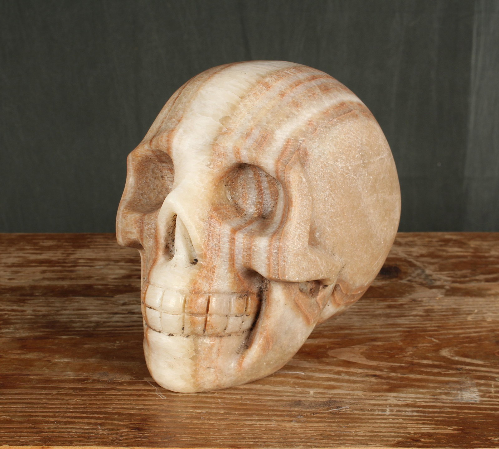 Carved Onyx Skull Garden Ornament: A good carved onyx large scale skull sculpture. Size: 9”H x 10”W x 8”D.