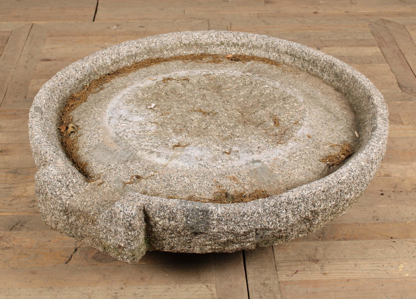 Cider Press Mill Stone: A large carved stone mill or grinding stone with spill way. Size: 6.5"H x 38.5" Dia.