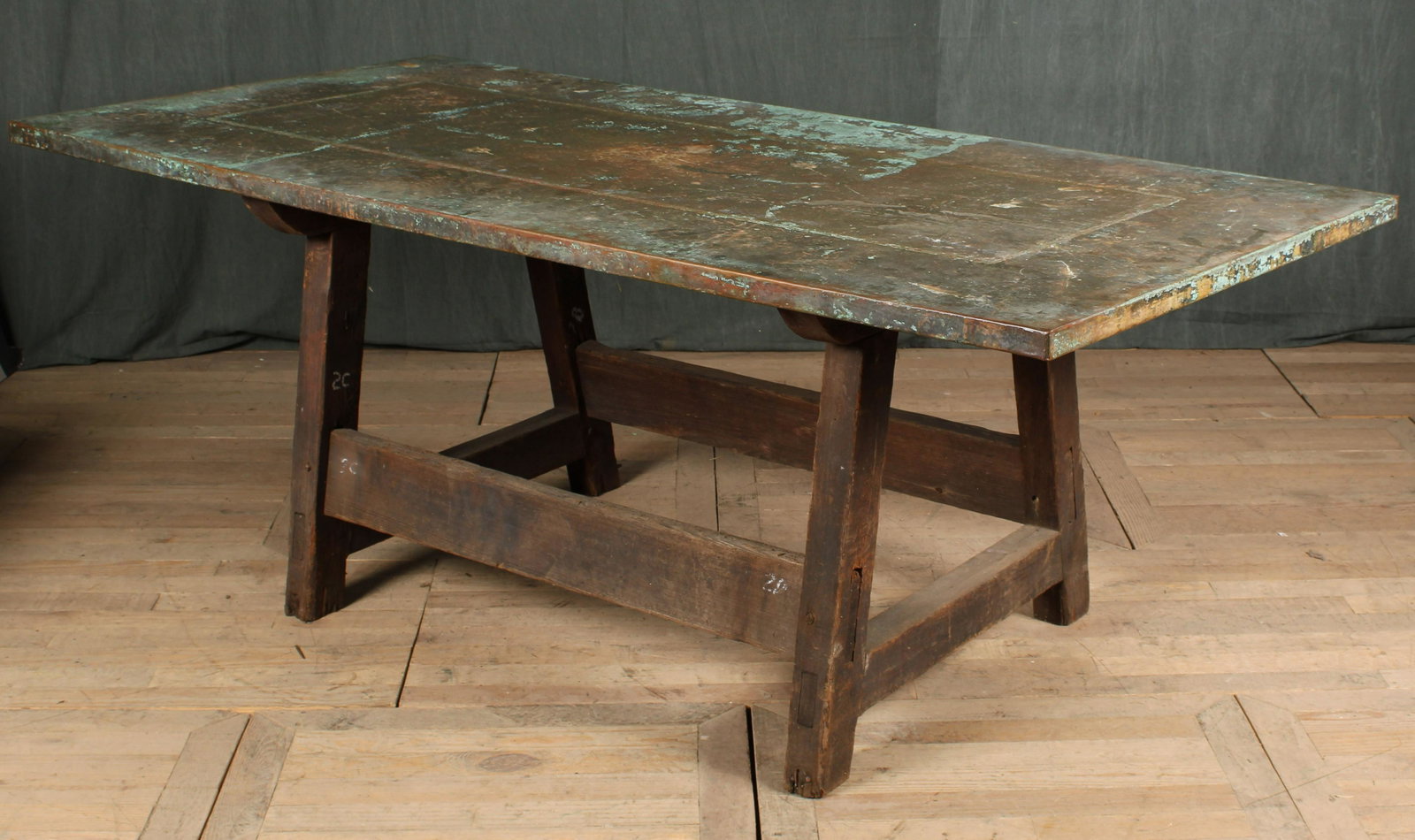 Copper Top Dining Table: A good copper top dinning table having a clad top supported on wood base with box stretcher. Size: 31"H x 84"W x 30"D