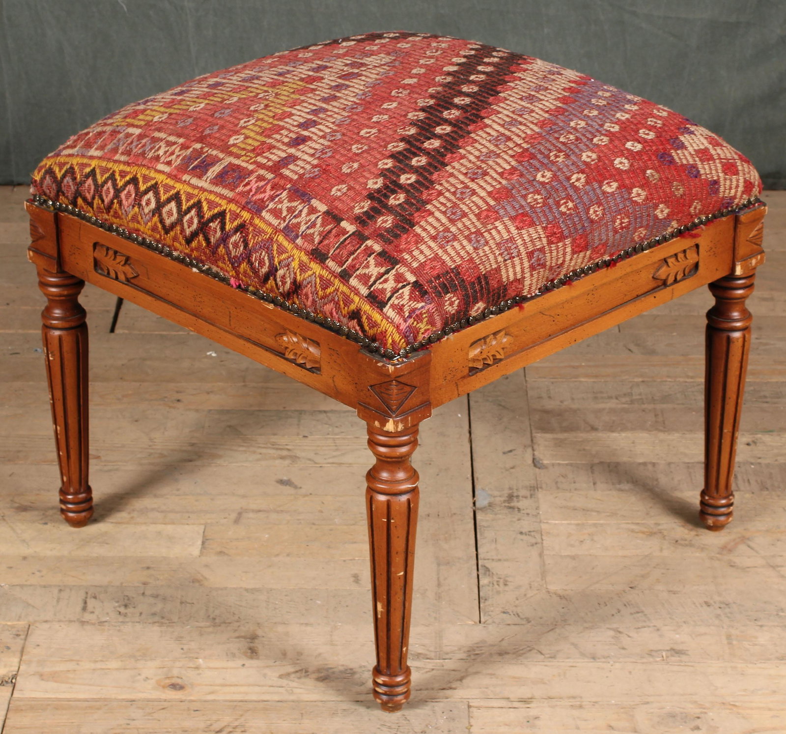 Louis XVI Style Kilim Upholstered Ottoman: A Louis XVI style upholstered ottoman or bench. Size: 19"H x 24"W x 24"D