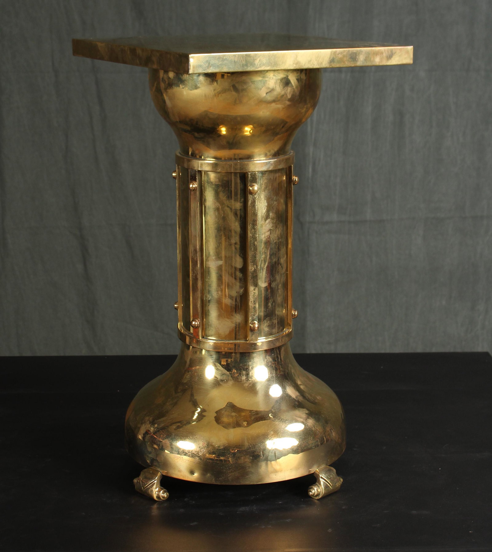 Secessionist Style Austrian Brass Table: A very good early 20th century Austrian brass side table having a square top supported on caged column and domed shaped base with scroll feet. Size: 22"H x 12"W x 12"D