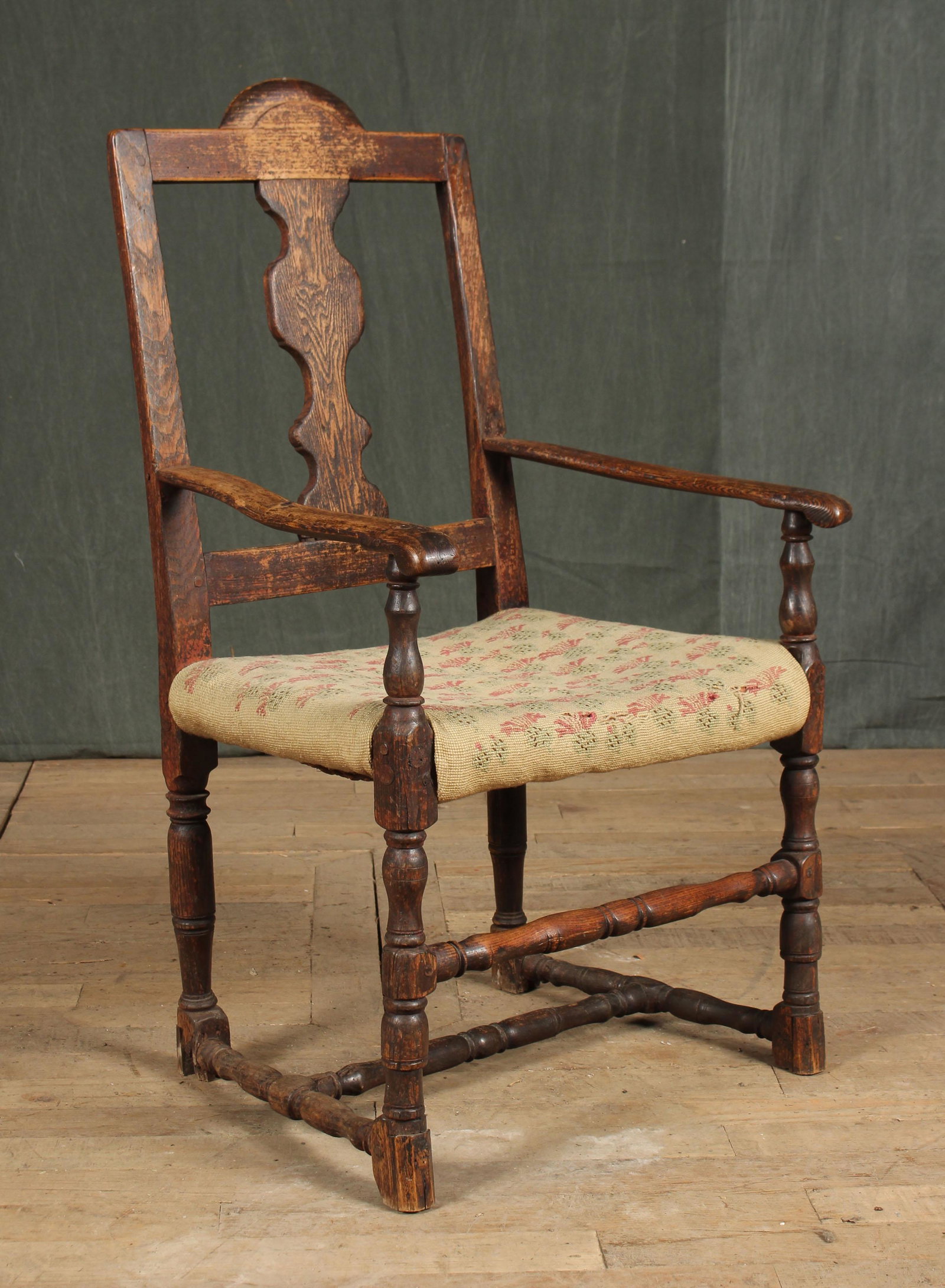 Late 18th, Early 19th C English Oak Country Chair: A possibly English 18th century armchair having shaped back split over upholstered rush seat raised on turned legs. Size: 38.5"H x 22"W x 17"D