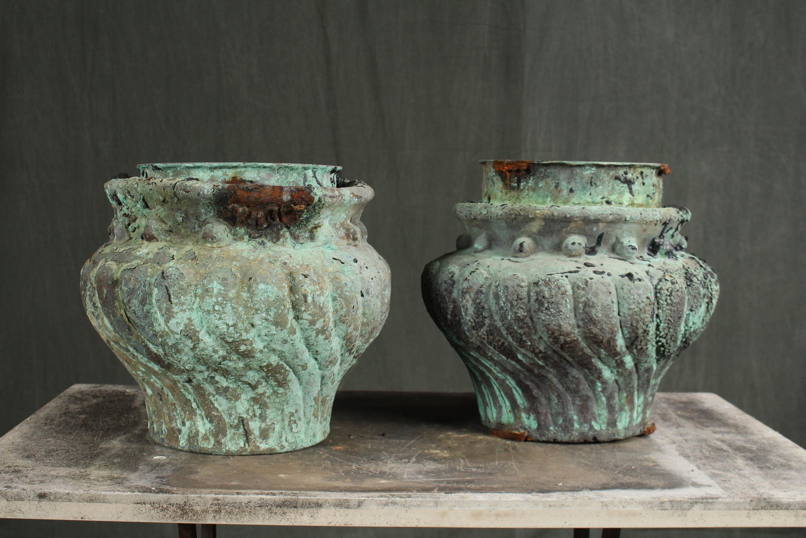 2 Brutalist Style Verdigris Copper Garden Urns: 2 Brutalist Style Verdigris Copper Garden Urns. Similar pair of melon form vessels. Salvaged industrial molds. Size: taller, 13" H x 14" diameter.