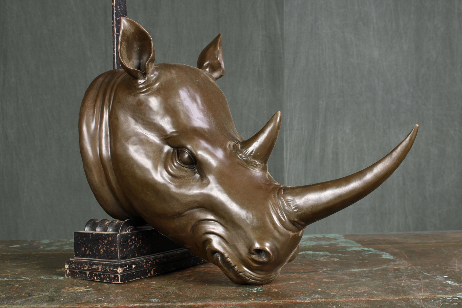 Bronze Rhino Bust: A very interesting bronze rhinoceros head sculpture. God detail and style presence. Size: 20"H x 12"W x 24"D