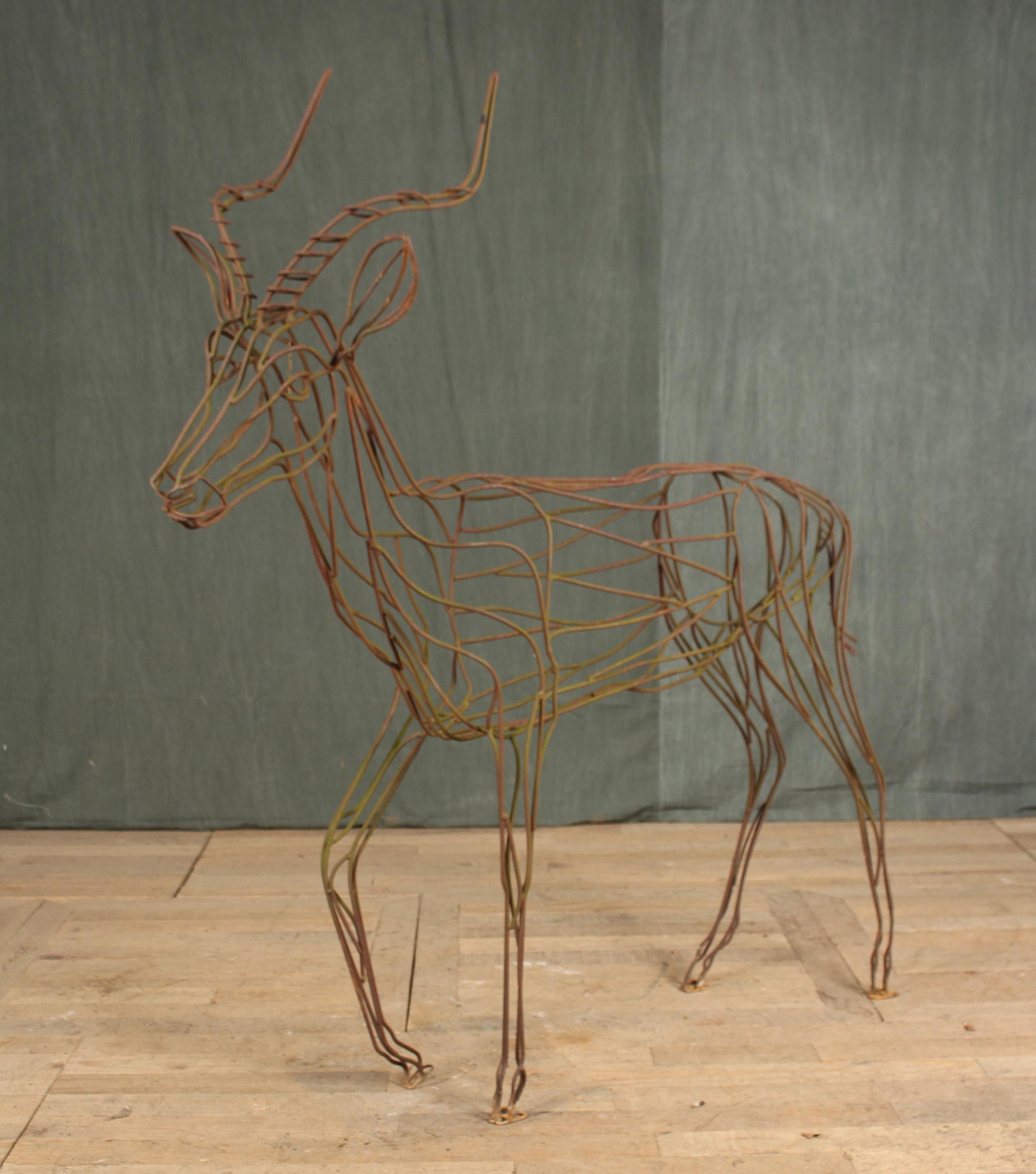 Wrought Iron Ibex Form Garden Sculpture: A good looking vintage wrought iron sculpture in the form of an ibex. Size: 56"H x 48"W x 10"D