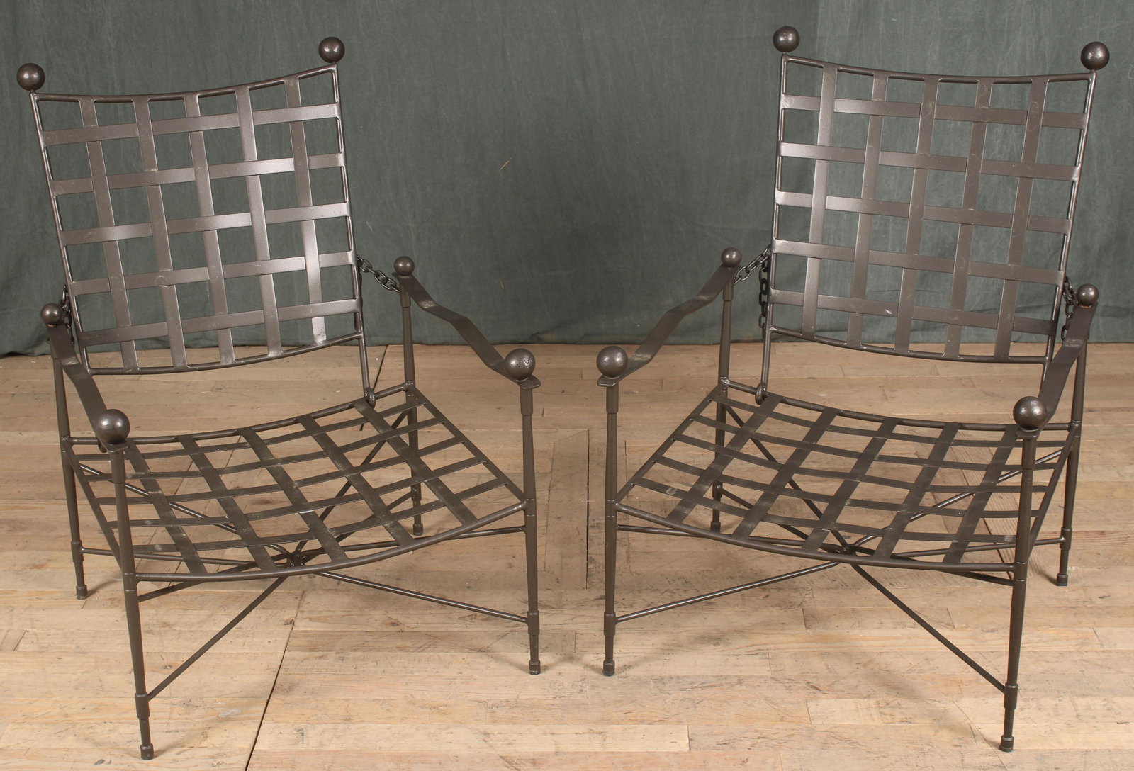 Pair Iron Strap Garden Chairs- Papperzini, Janus: A good pair of Mario Papperzini/ Janus et Cie iron garden chairs each having adjustable backs and ball decoration. Size: 37"H x 22.5"W x 27"D to 48" when fully reclined