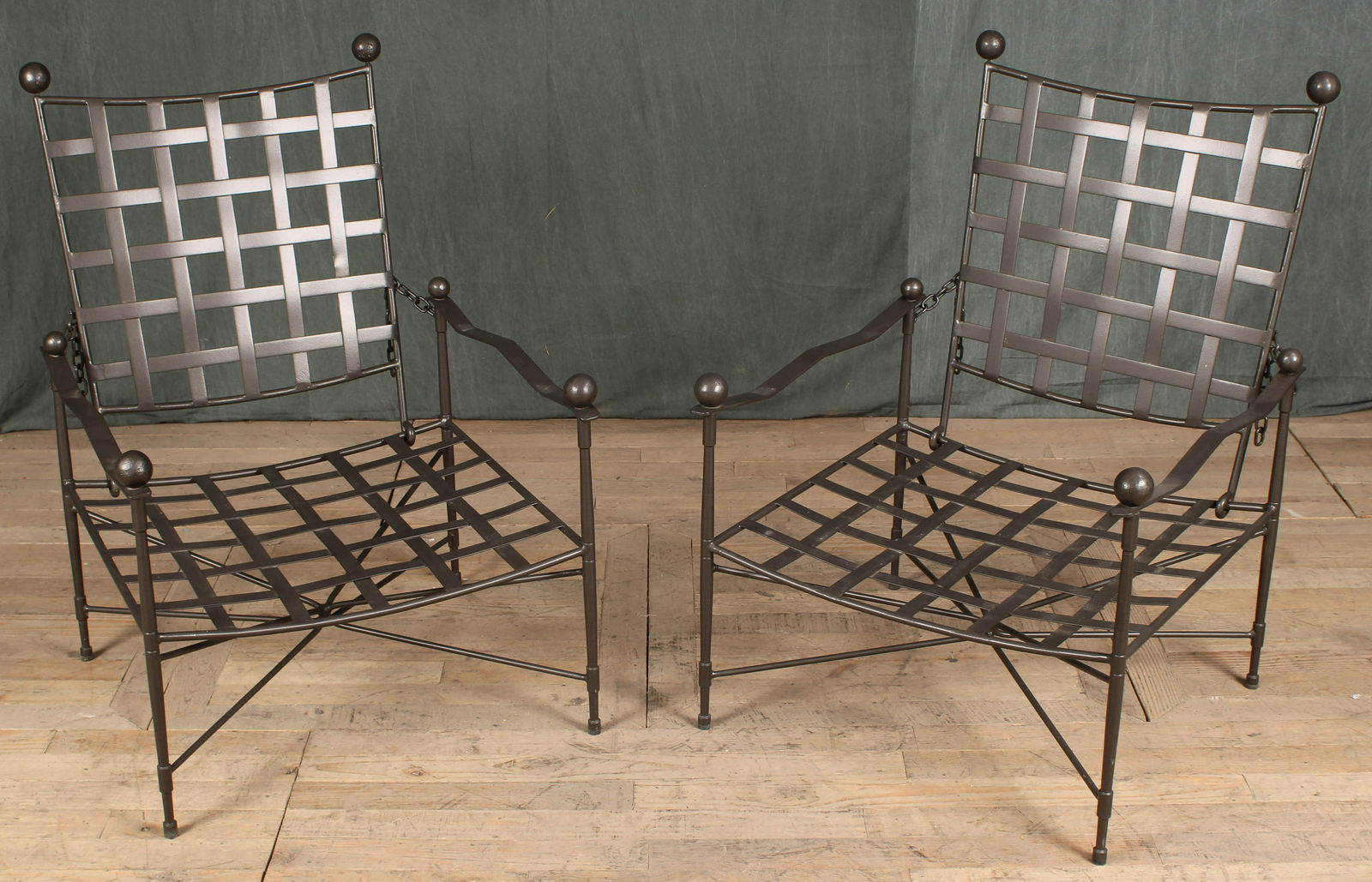 Pair Iron Strap Garden Chairs- Papperzini, Janus: A good pair of Mario Papperzini/ Janus et Cie iron garden chairs each having adjustable backs and ball decoration. Size: 37"H x 22.5"W x 27"D
