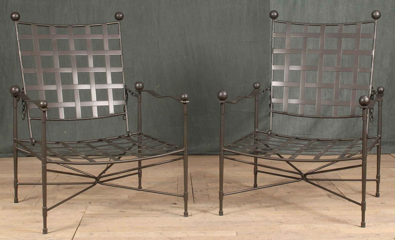 Pair Iron Strap Garden Chairs- Papperzini, Janus: A good pair of Mario Papperzini/ Janus et Cie iron garden chairs each having adjustable backs and ball decoration. Size: 37"H x 22.5"W x 27"D to 48" when fully reclined