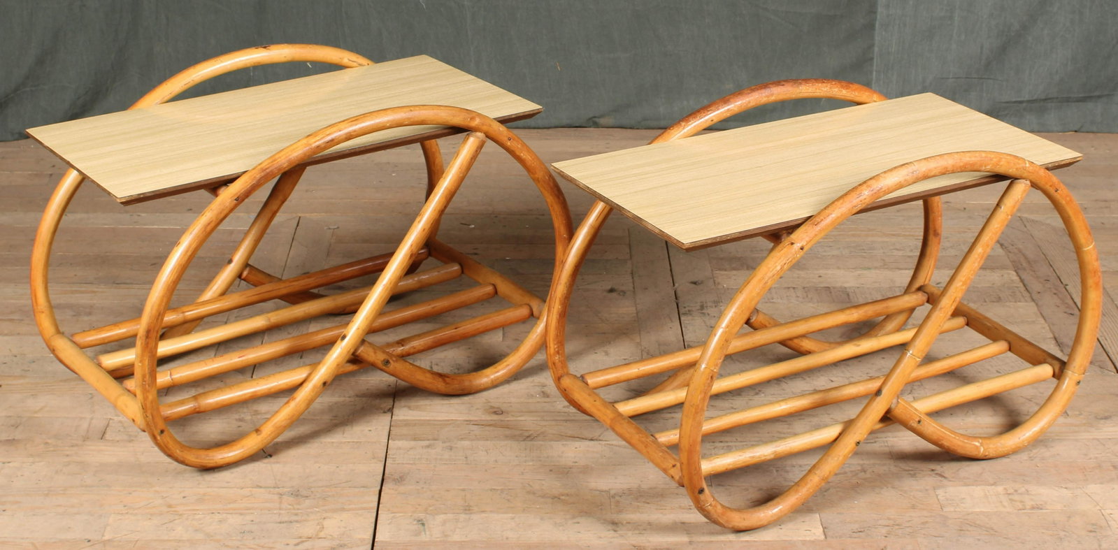 Pair Pretzel Form Rattan Side Tables: A pair of vintage pretzel form rattan side tables. Size: 19"H x 31.5"W x 17"D