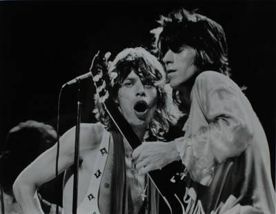 Jagger & Richards Live in 1972: Mick Jagger and Keith Richards by Bob Gruen. Live at Madison Square garden, NYC, 1972 Press Photo. Snippet on verso. Original vintage silver gelatin print. (RS1116) Photo size: 7"T x 9"L, Frame size: