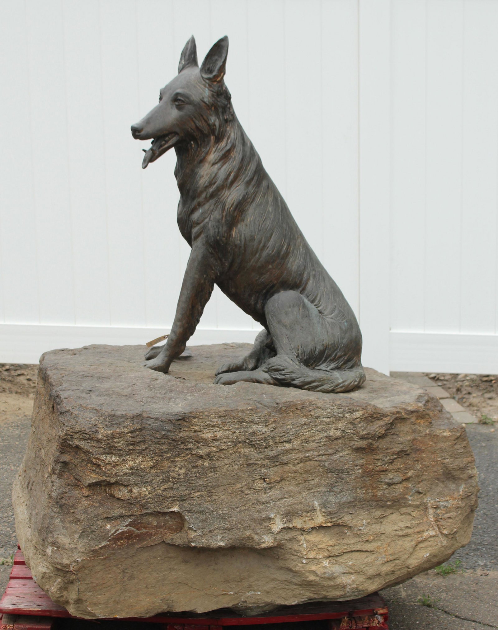 Grand Figural Bronze Shepherd on a Boulder: Grand Figural Bronze Shepherd on a Boulder. Size: 60" overall height. dog, 36" x 24" x 16" rock is irregularly shaped at 24" H x 44" W x 48" D