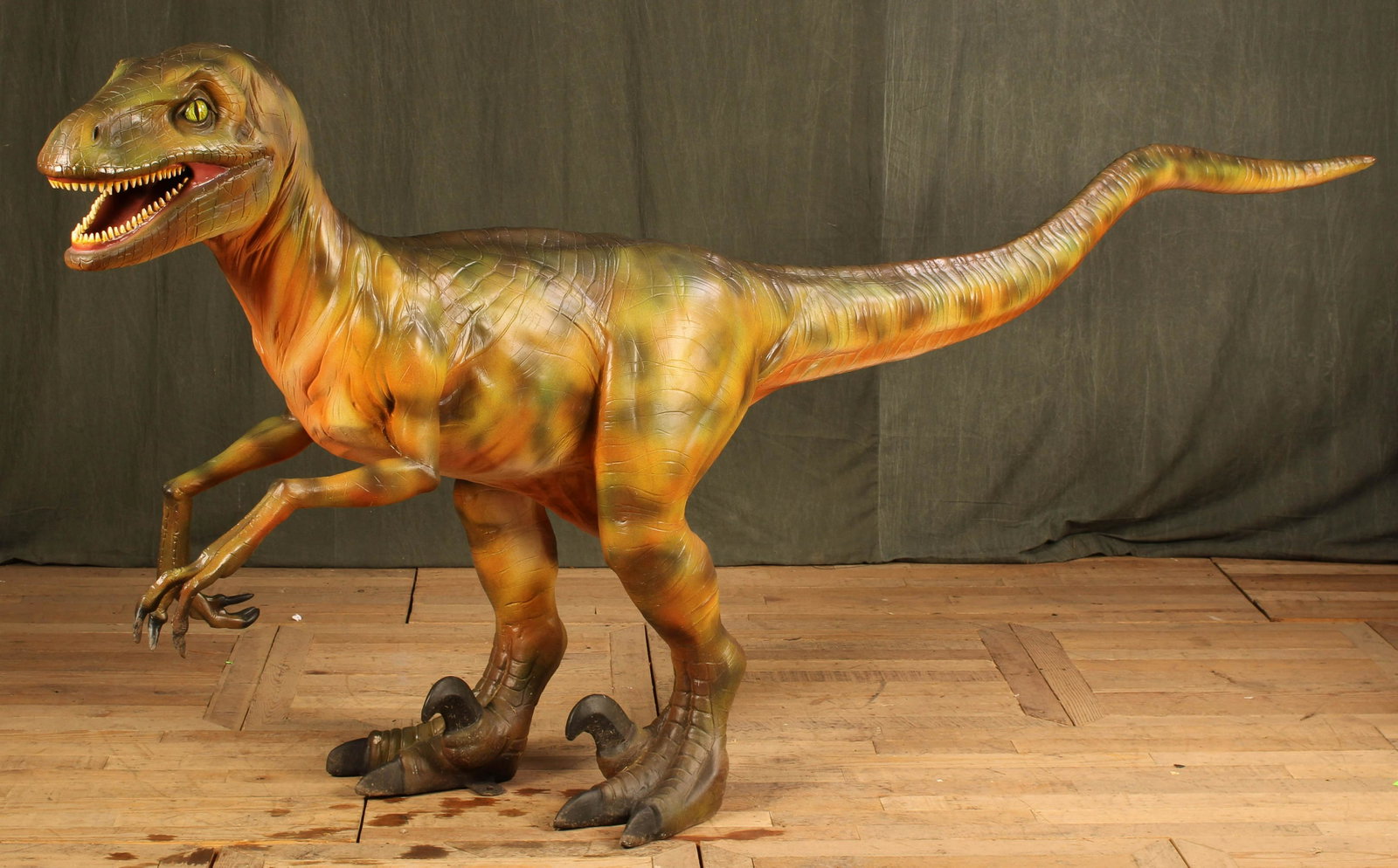 Fantasy Velociraptor Type Dinosaur Model: A good fantasy dinosaur in the form of a Velociraptor with open mouth and talon feet. Great for the yard or by the pool. Resin. Size: 50"T x 114"L x 28"W