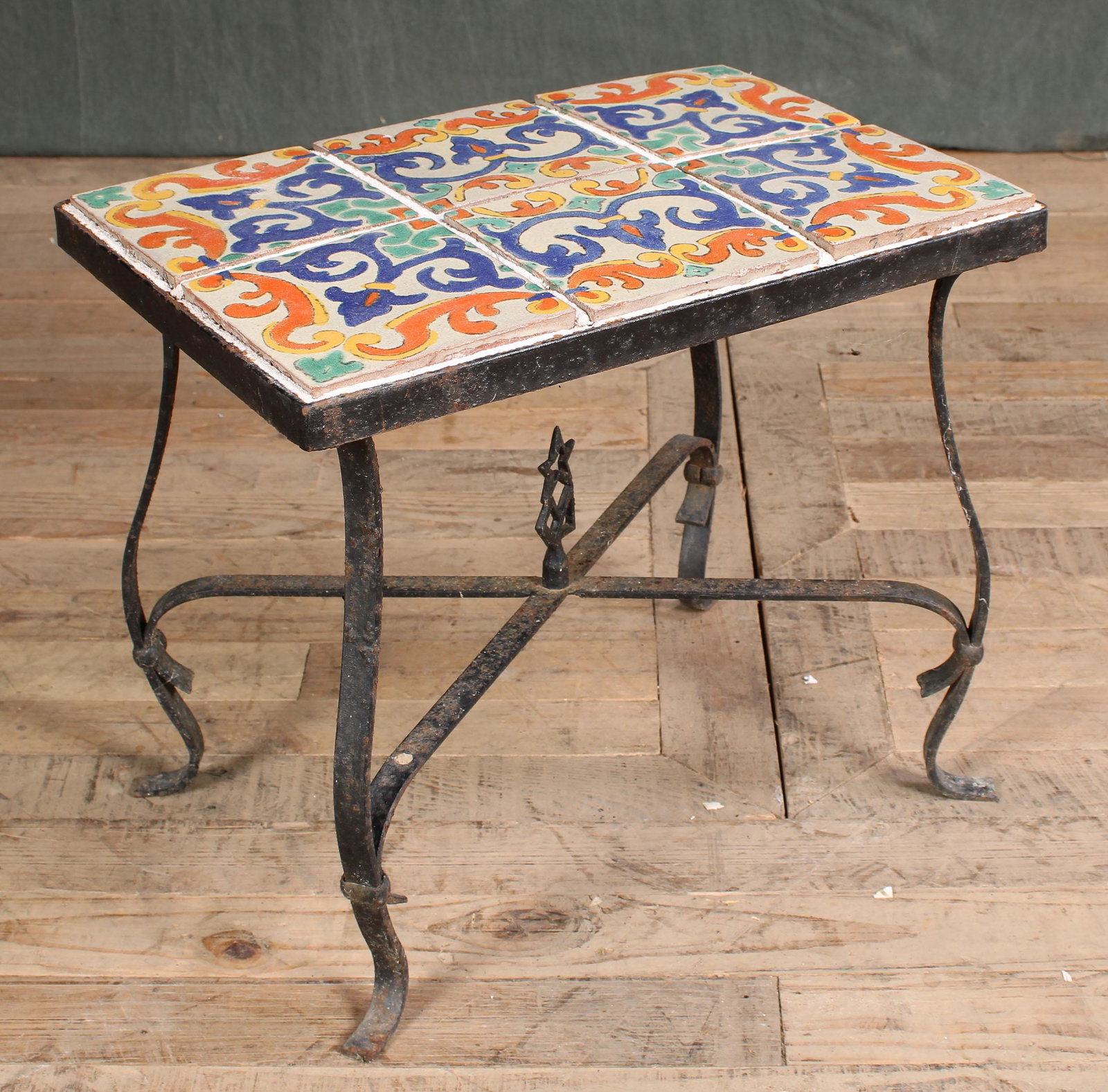 Catalina Tile Table: A Spanish revival wrought iron side table with Catalina style inset tiles. Size: 16"T x 19"L x 13"D