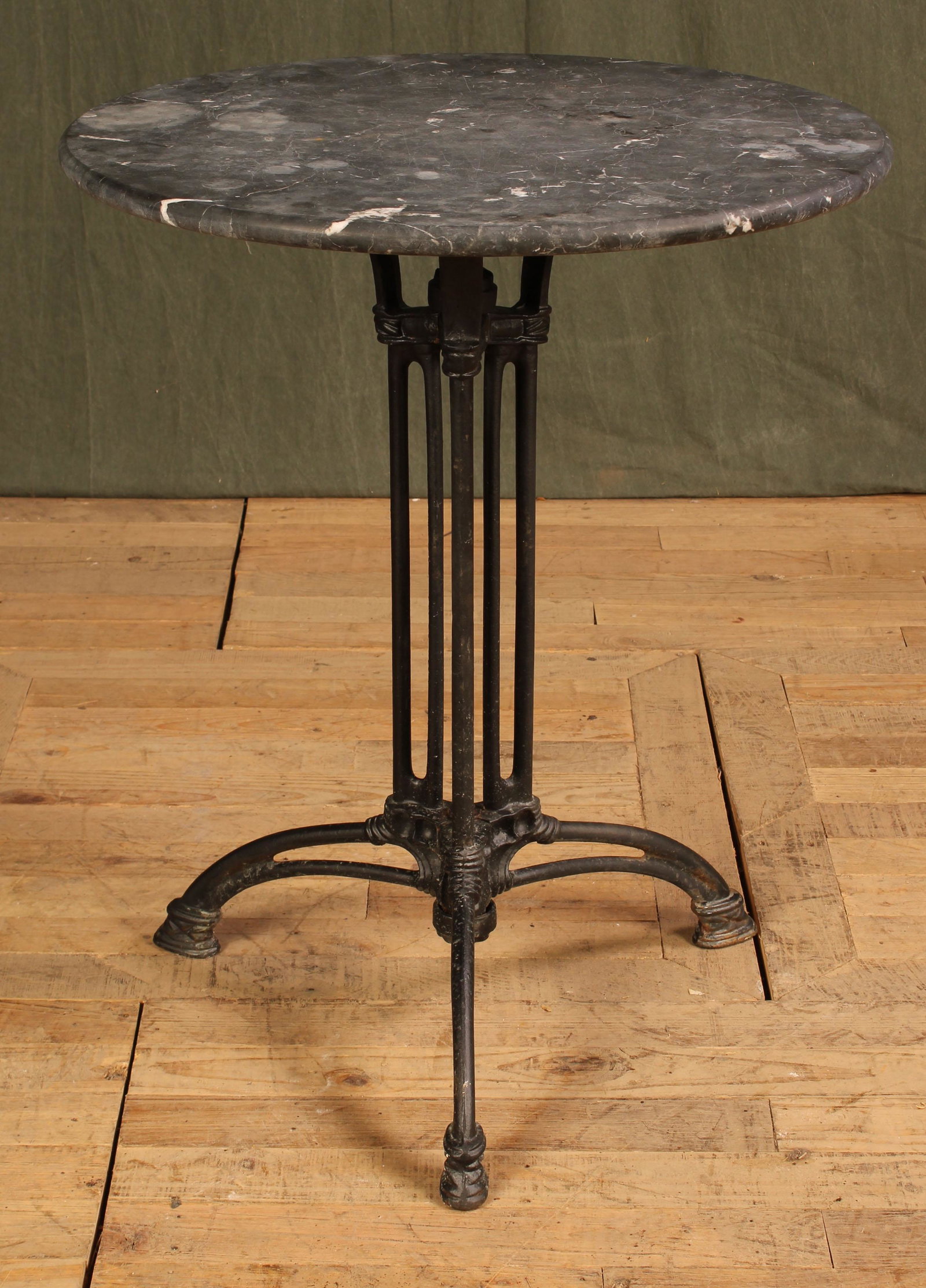 Marble Top Garden Table: A marble top garden table having cast and wrought iron base. Size: 28.5"H x 27.75"Dia.