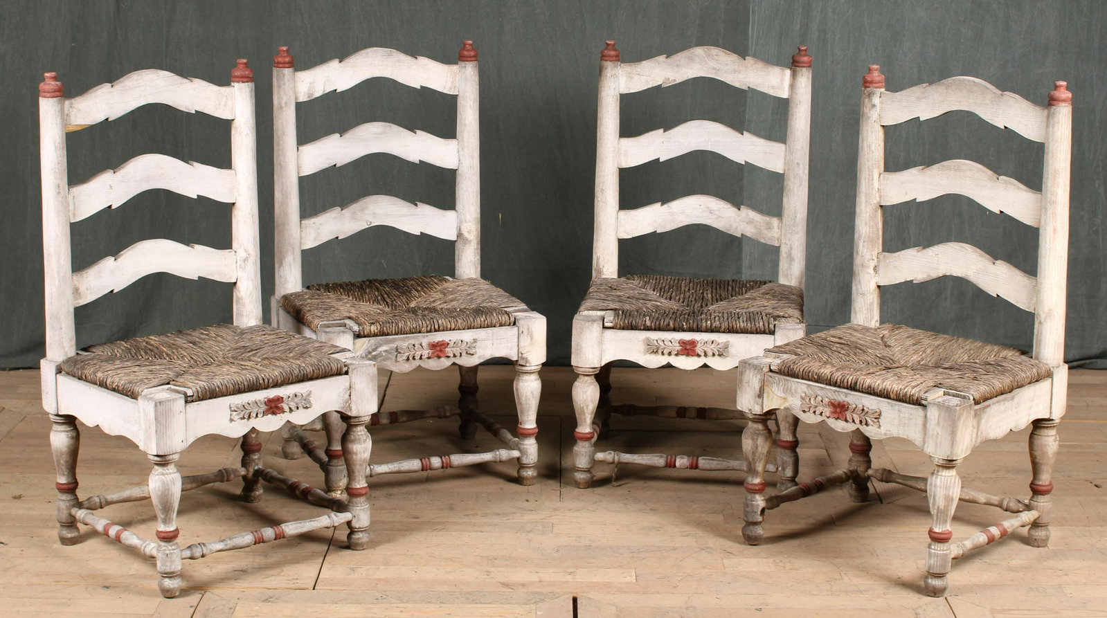 Set of 4 Hacienda Style Ladder Back Chairs: An interesting set of four painted ladder back chairs having rush seat. Great old color and style. Size: 41"H x 21.5"W x 19"D