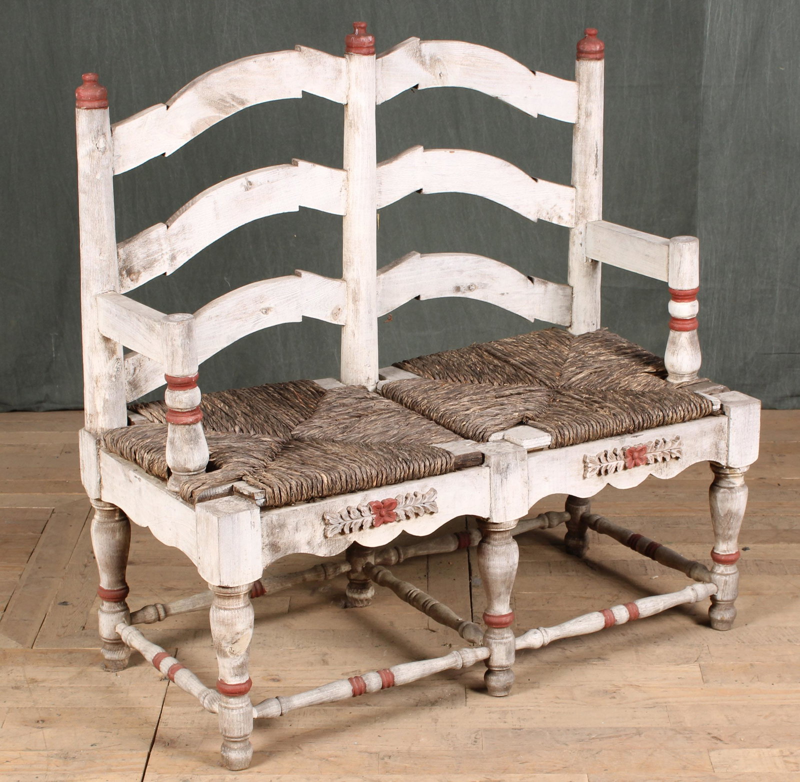 Hacienda Style Ladder Back Settee: An interesting double ladder back settee with paint decoration and rush seat. Size: 41"H x 41"W x 19"D