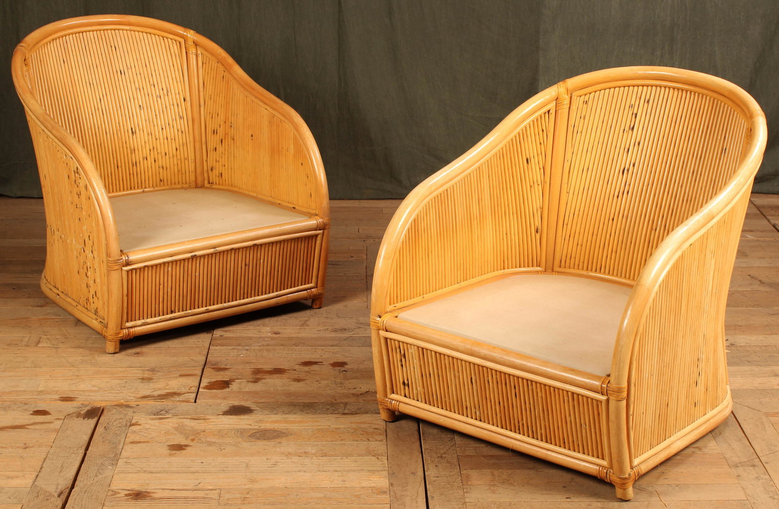 Pair Pencil Reed Club Chairs: A pair of Pencil Reed rattan club chairs. Good vintage style and scale. No cushions. Size: 31"T x 26.5"L x 29"D