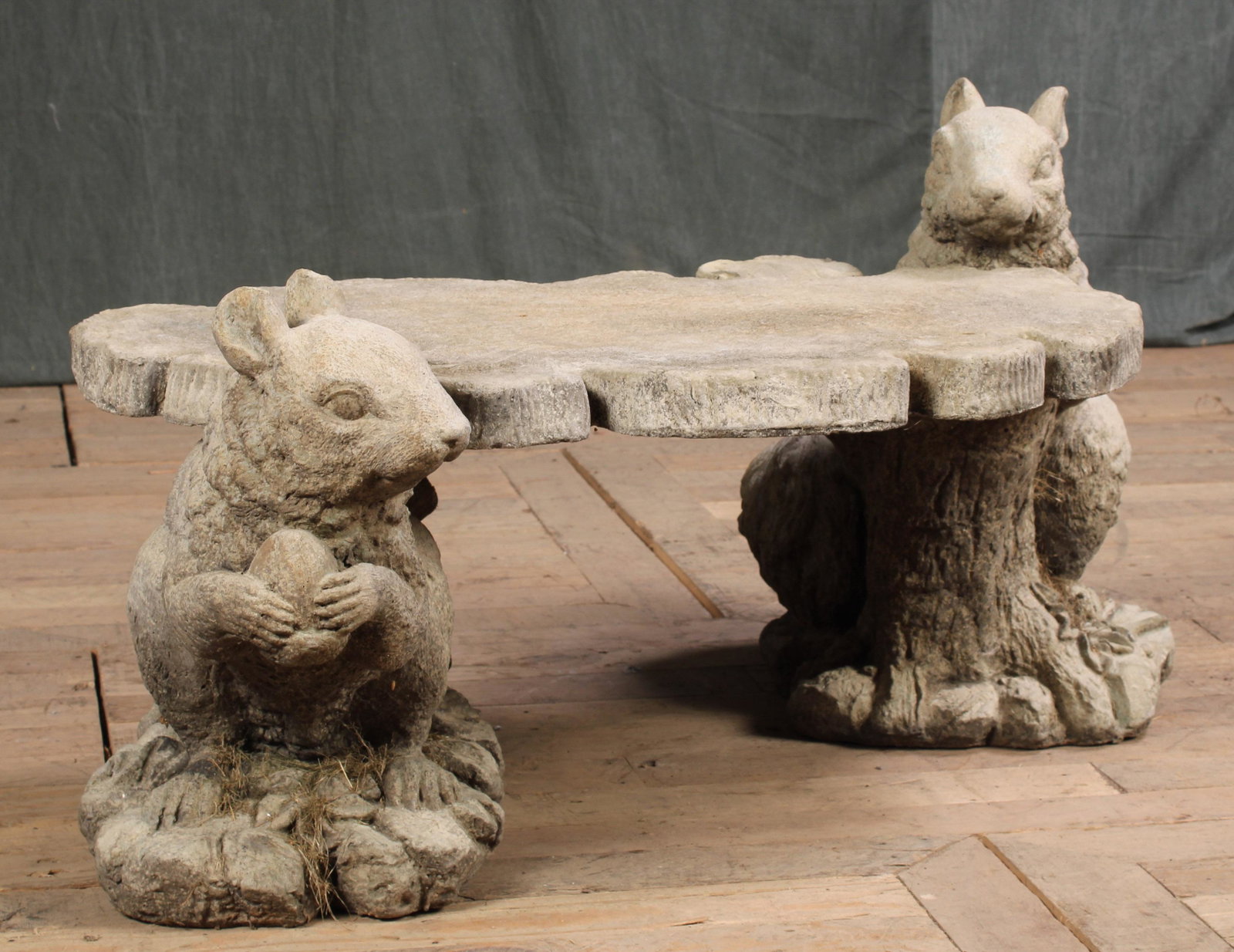 Cast Stone Squirrel Bench: Interesting cast stone squirrel form garden bench having free form seat supported by two seated squirrels. Size: 18"H x 40"W x 16"D