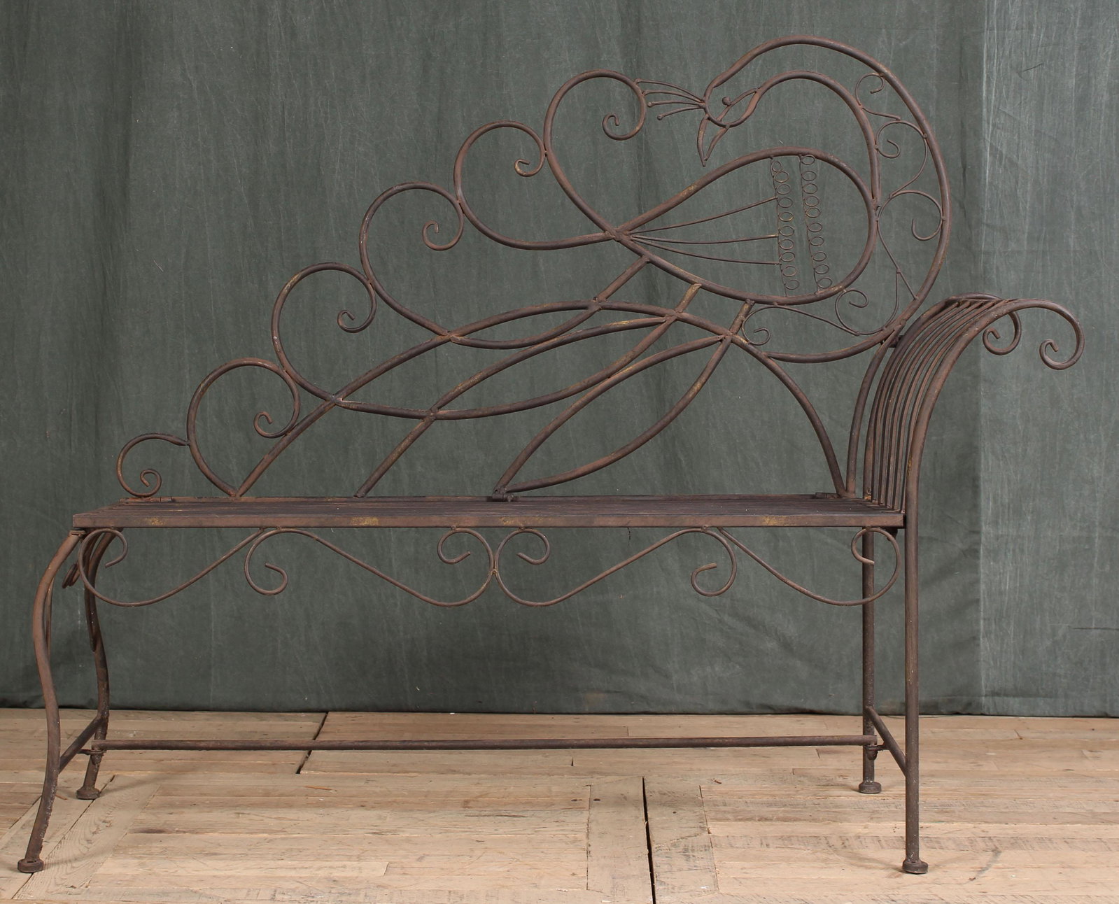 Wrought Iron Peacock Motif Garden Bench: A wrought iron peacock decorated garden bench with slat seat. Size: 41.5"T x 50"L x 17.5"D