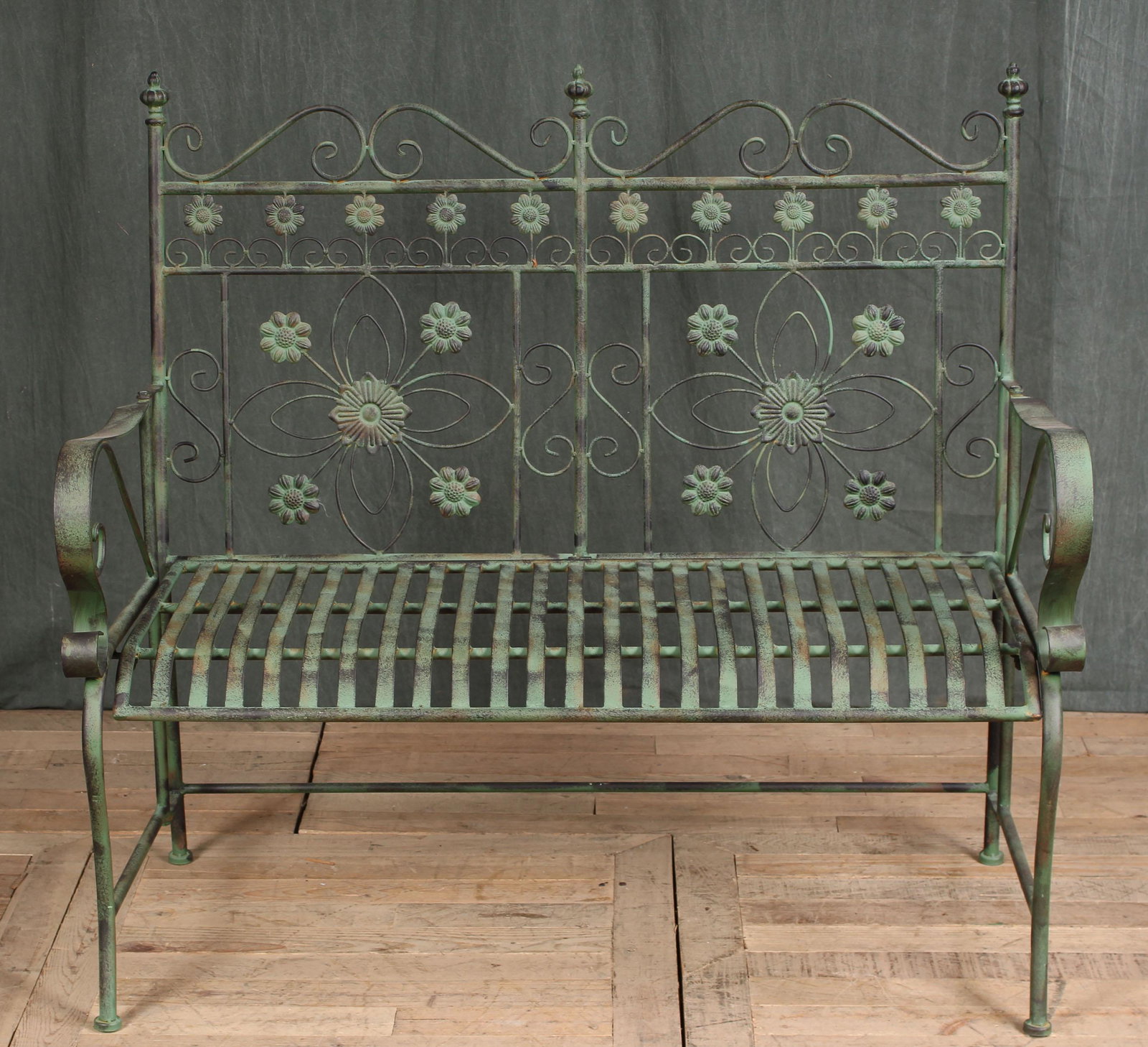 Wrought Iron Foliage Garden Bench: A wrought iron garden bench with scroll and floral decoration. Size: 40"H x 42"W x 21"D