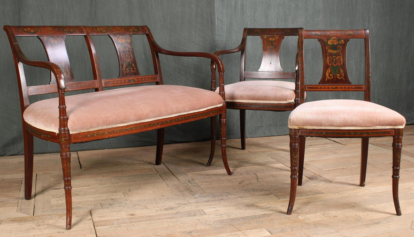 3 Pc. Adam Style Seating Suite: A set of three late 19th Century Adams style settees and chairs all with painted crest rails and back splats over upholstered seats and supported on faux bamboo legs. Sizes: settee 33.5"T x 41"L x 24"