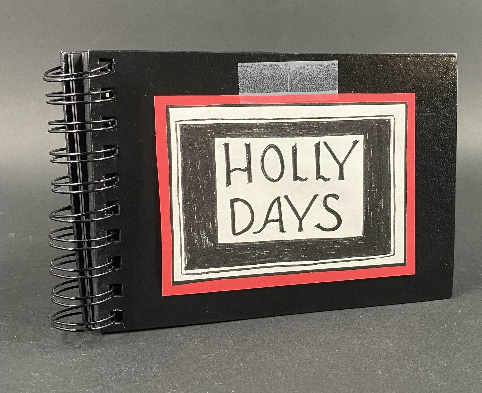 Janet Baer, Holly Days, No. 1/2, The Gorey Goat: Janet Baer, Holly Days, No. 1/2, The Gorey Goat. Album of Christmas Holiday drawings detailing the mishaps of holiday prep and celebration with a drawing titled The Gorey Goat. Numbered 1 of 2. Alba V