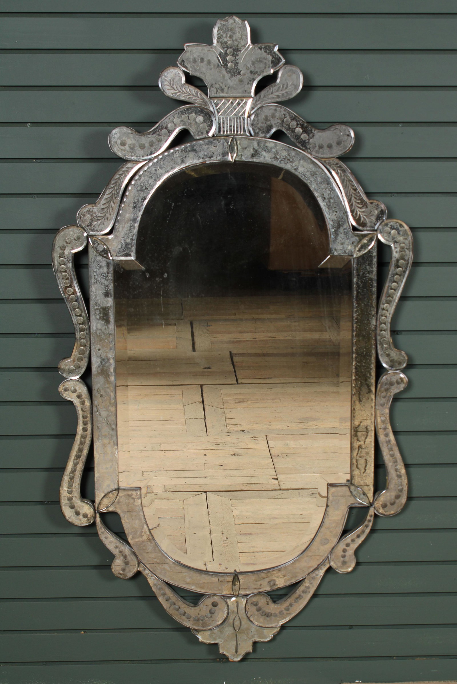 Venetian Mirror: A good vintage venetian mirror having basket form crest framed by scroll decoration and beveled glass mirror. Size: 56.5" x 30.5"