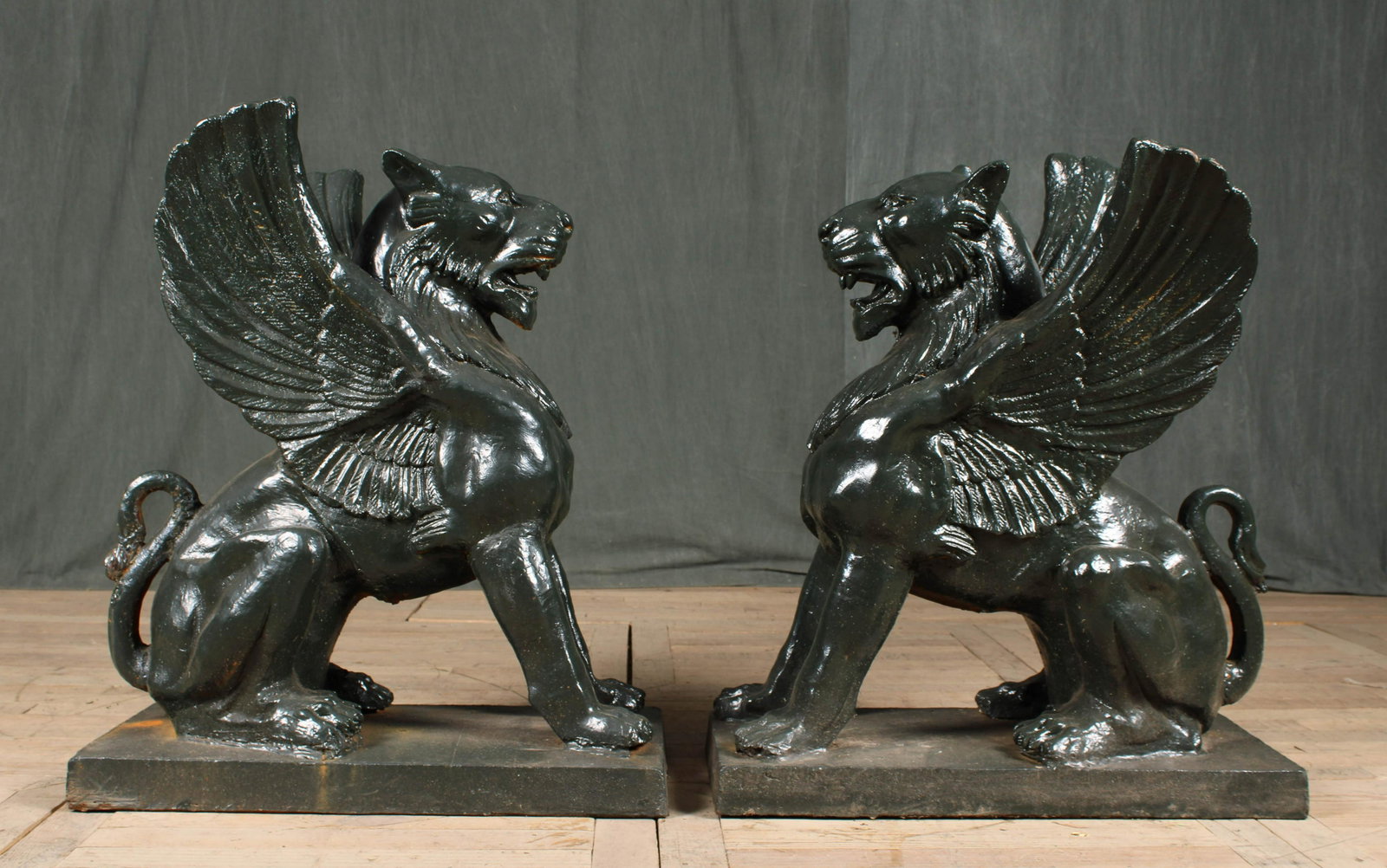 Pair Cast Iron Griffin Form Entryway Figures: Pair Cast Iron Griffin Form Entryway FiguresSize: 35.75" H x 15" W x 30" D