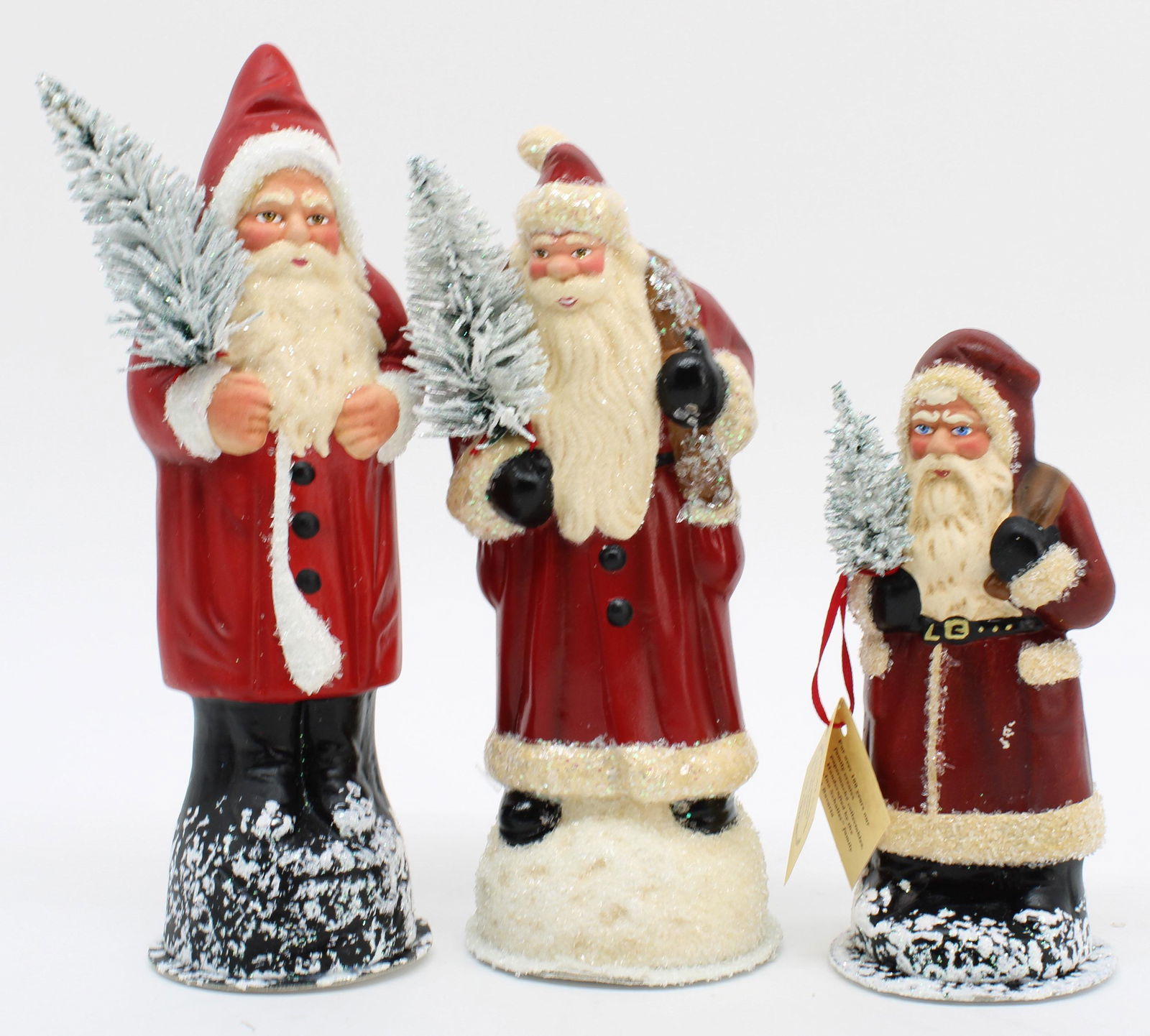 Papier Mache Santas: Three Santas from a single owner collection. All are handmade papier mache by Ino Schaller in Germany. Bottoms have removable caps for containing candy. Size: 10"T; 9.25"T; 7"T