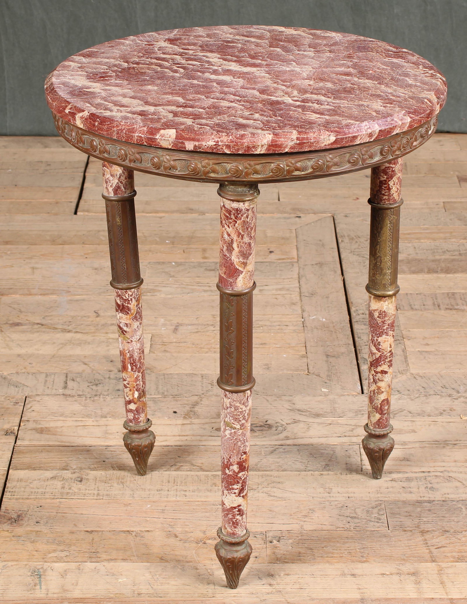 French Marbel and Bronze Gueridon: A good antique French marble and bronze gueridon having a floral banded apron supported on turned marble and bronze legs. Size: 23.5"T x 19" diameter