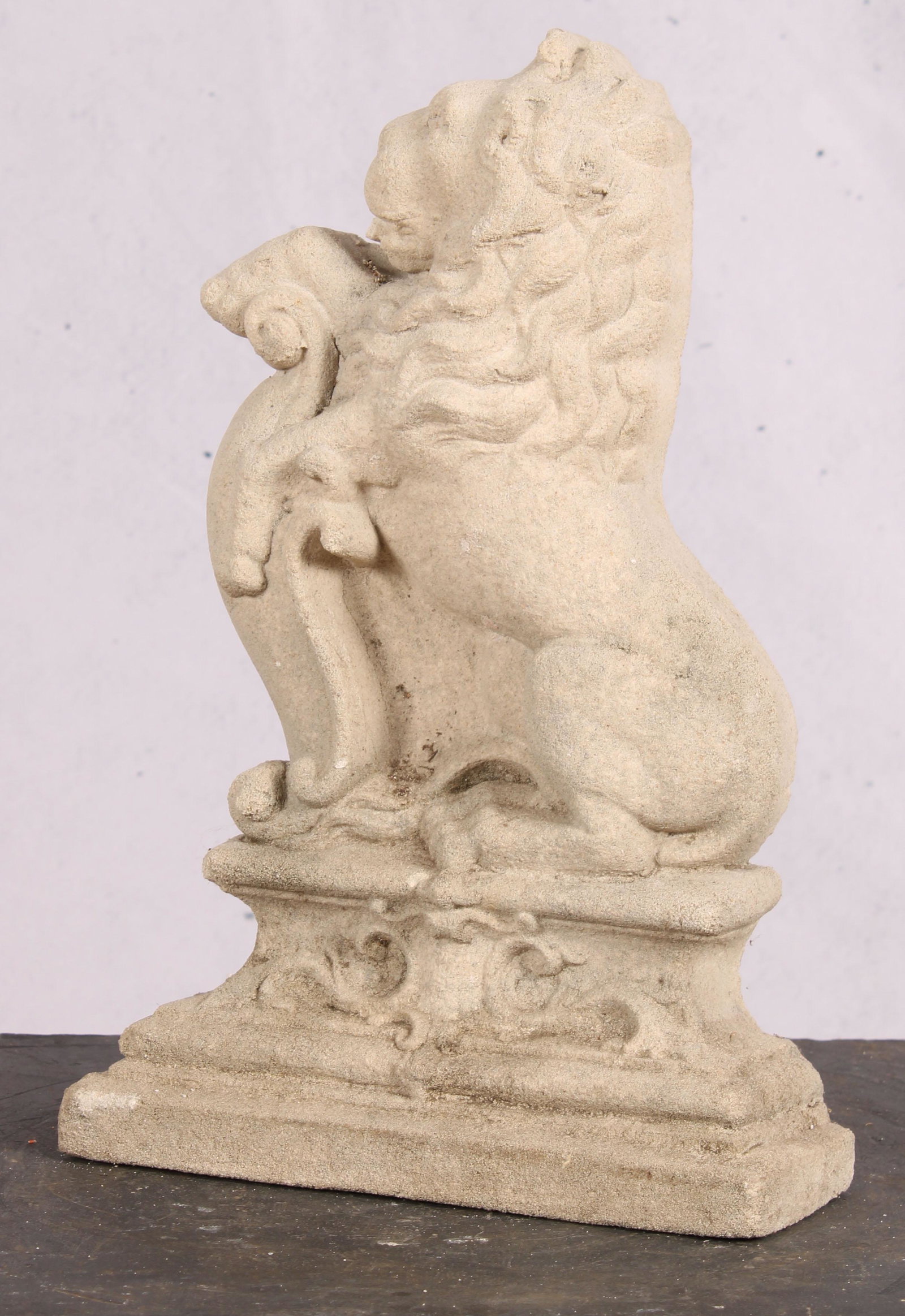 Cast Stone Lion Door Stop: A cast stone rampant lion form door stop. Size: 15.5"H x 10.5"W x 3.5"D