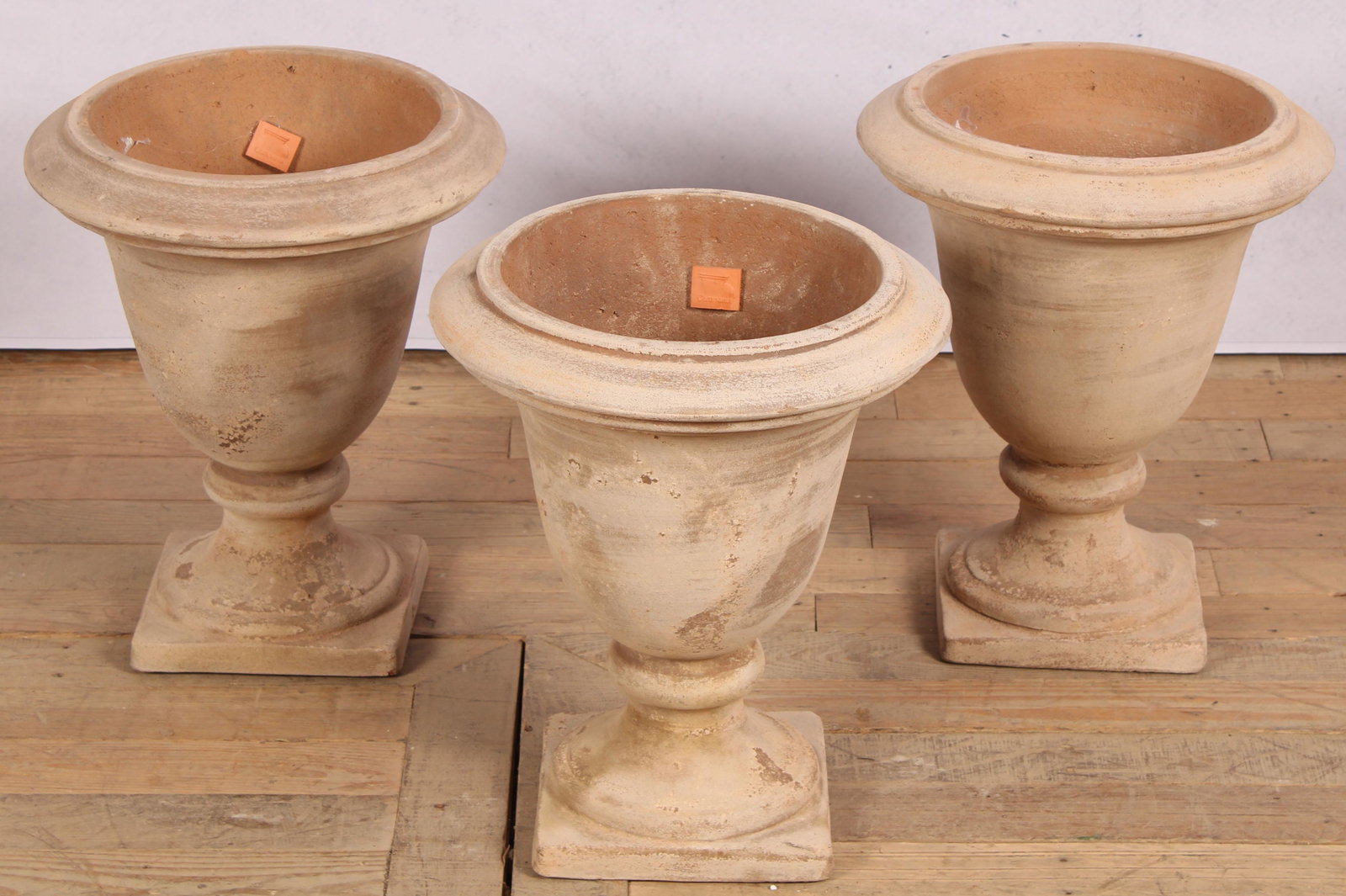 3 Terracotta Urns, Labeled Campana: A lot of three labeled campana terra cotta garden urns. Size: 16"H x 13.5"Dia.