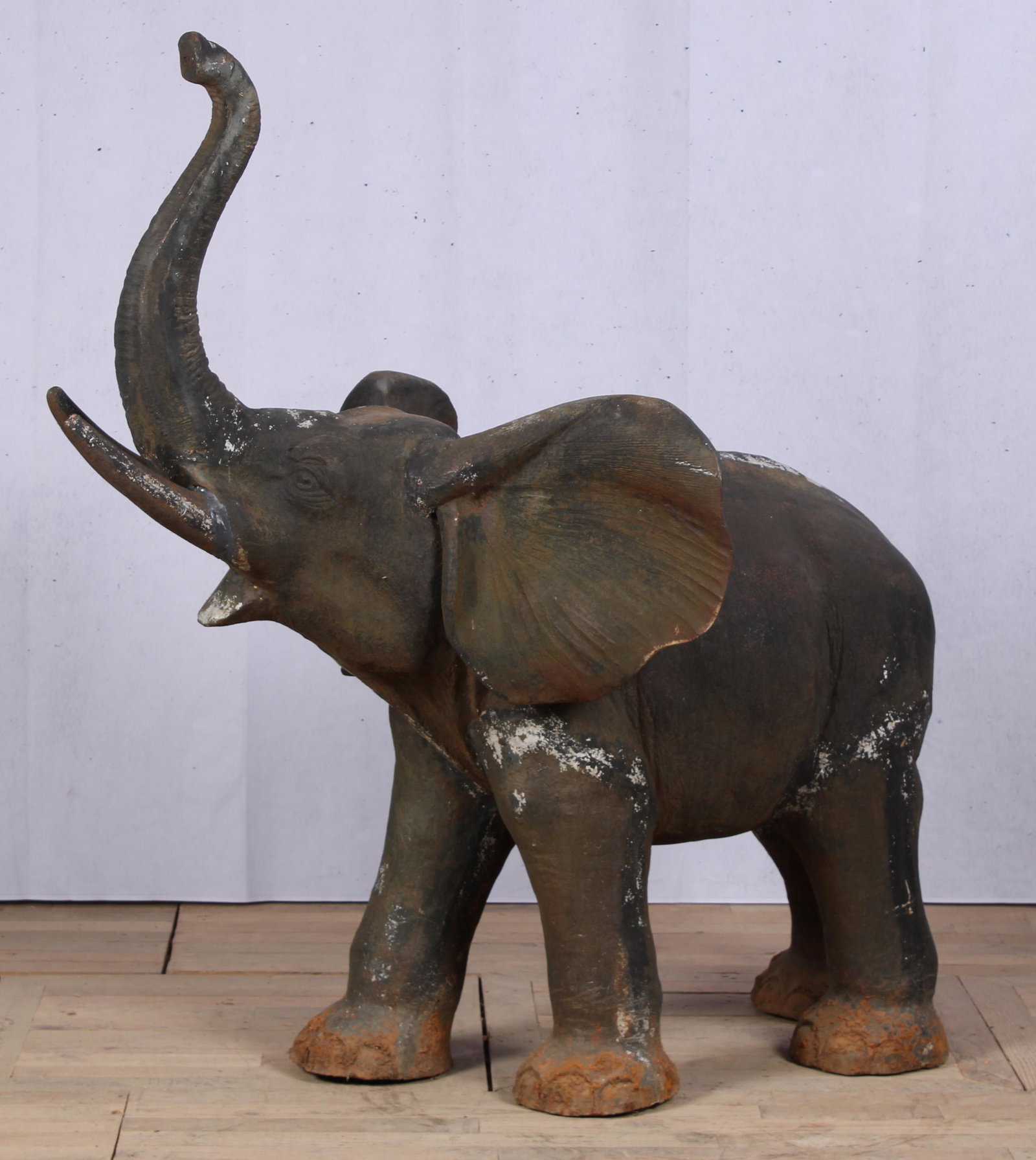 Cast Iron Elephant Garden Statue: A good cast iron elephant with upraised trunk. Great scale for the garden. Size: 58.5"H x 56"W x 31"D