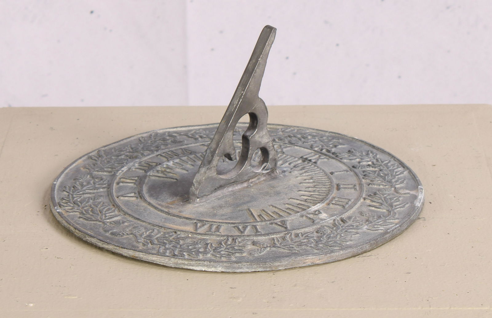 Oak Leaves and Acorns Motif Sundial, Lead: An English larger scale cast lead sundial with foliate decoration. Measured: H 5" x Dia. 11"