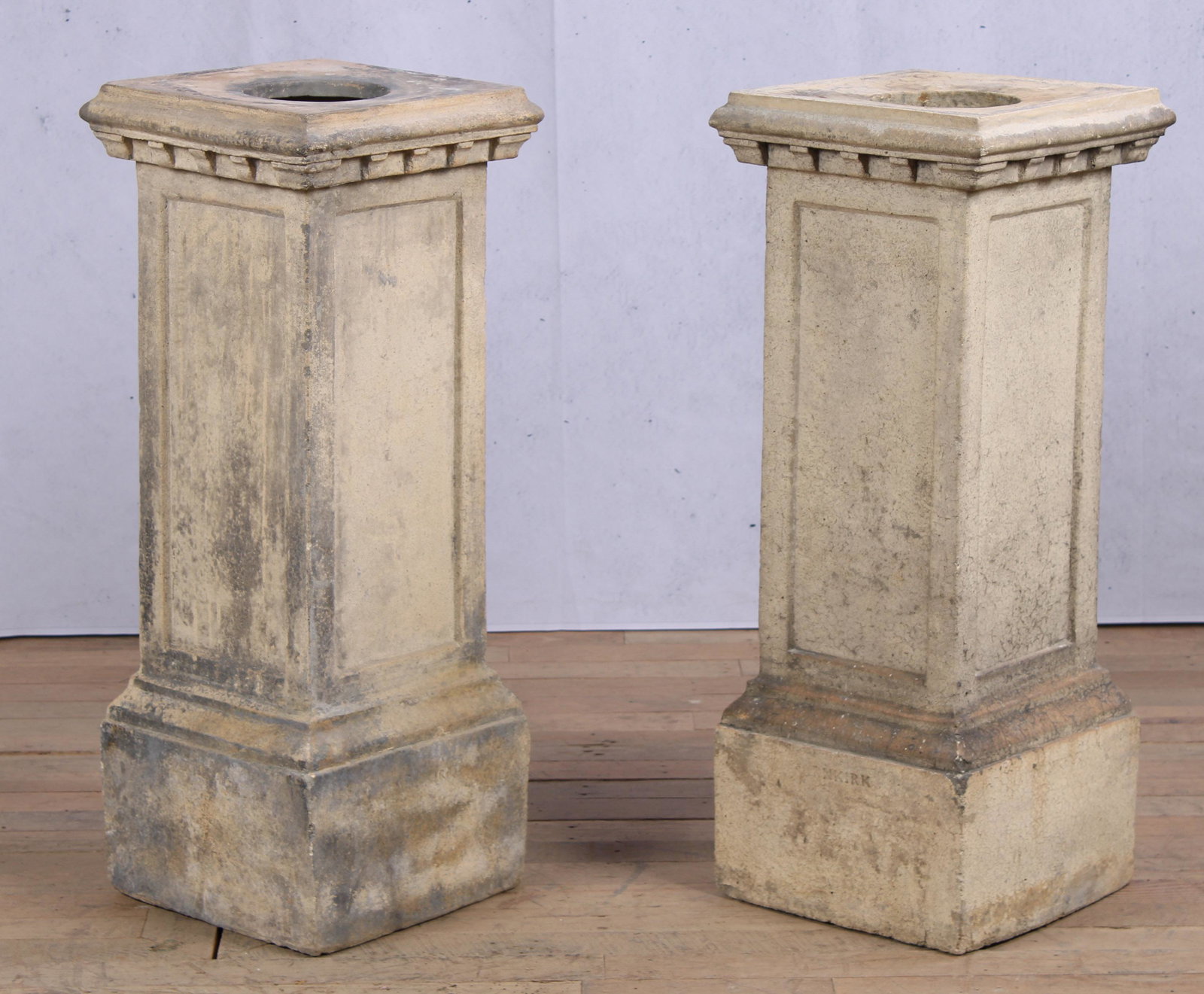 Pair Buff Terracotta Pedestals, Stamped Garnkirk: A pair of antique terracotta pedestals each having stepped top with detail molding over paneled sides and stepped base. Size: 34"H x 13.5"W x 13.5"D