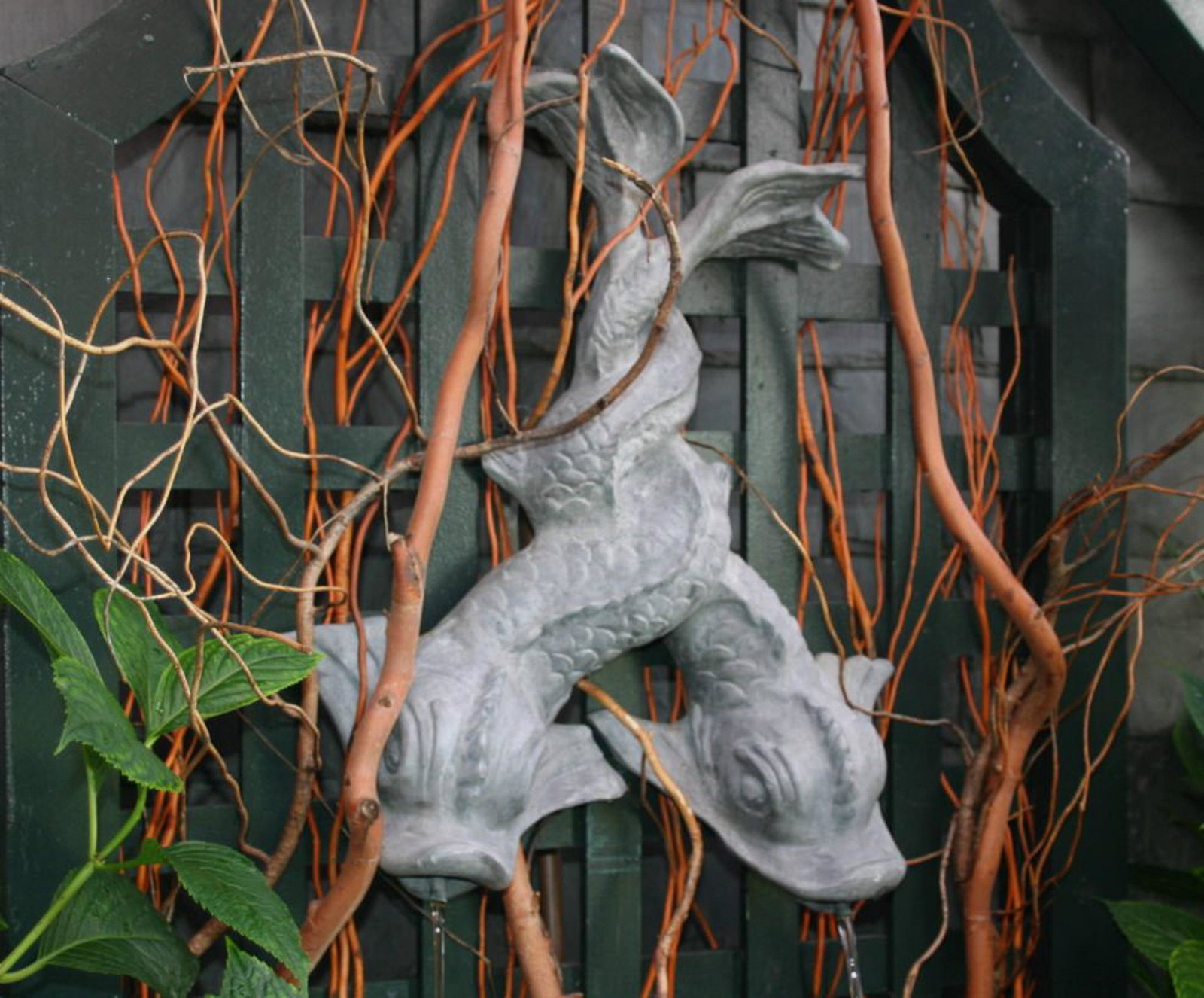 English Lead Entwined Dolphin Fountain Spout: An Interesting lead intertwined mythical dolphins/serpents wall fountain. Size: 19"H x 16"W x 3"D