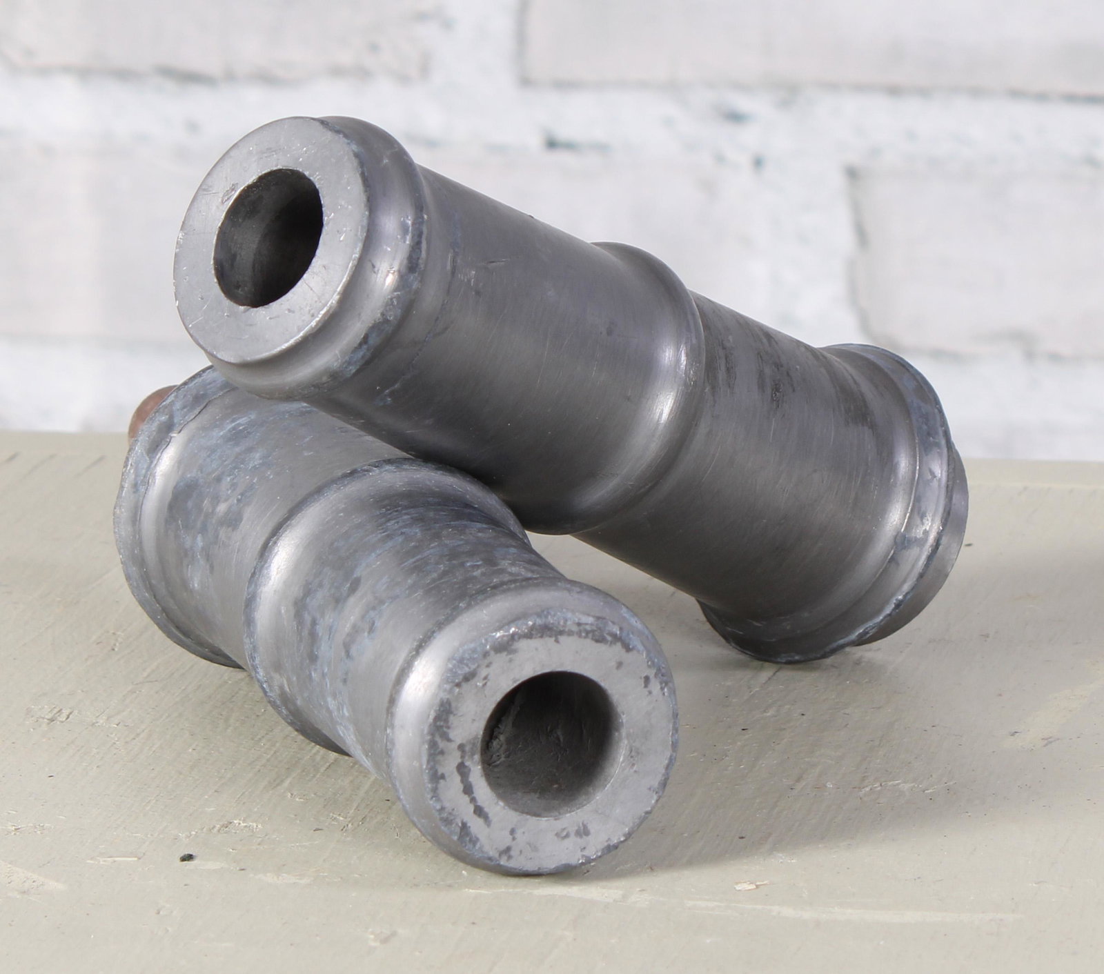 Pair of English Lead Fountain Spouts: A pair of English lead garden water spouts. Measured: L 6" x Dia. 2.25"