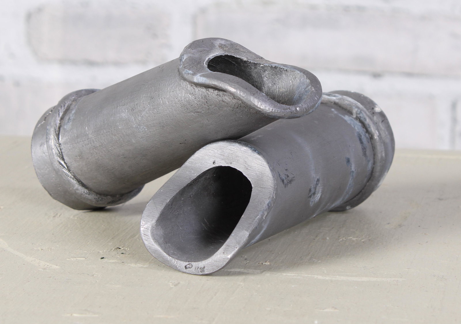 Pair of English Lead Scuppers: A pair of English lead garden water spouts. Measured: L 6" x Dia. 2.25"