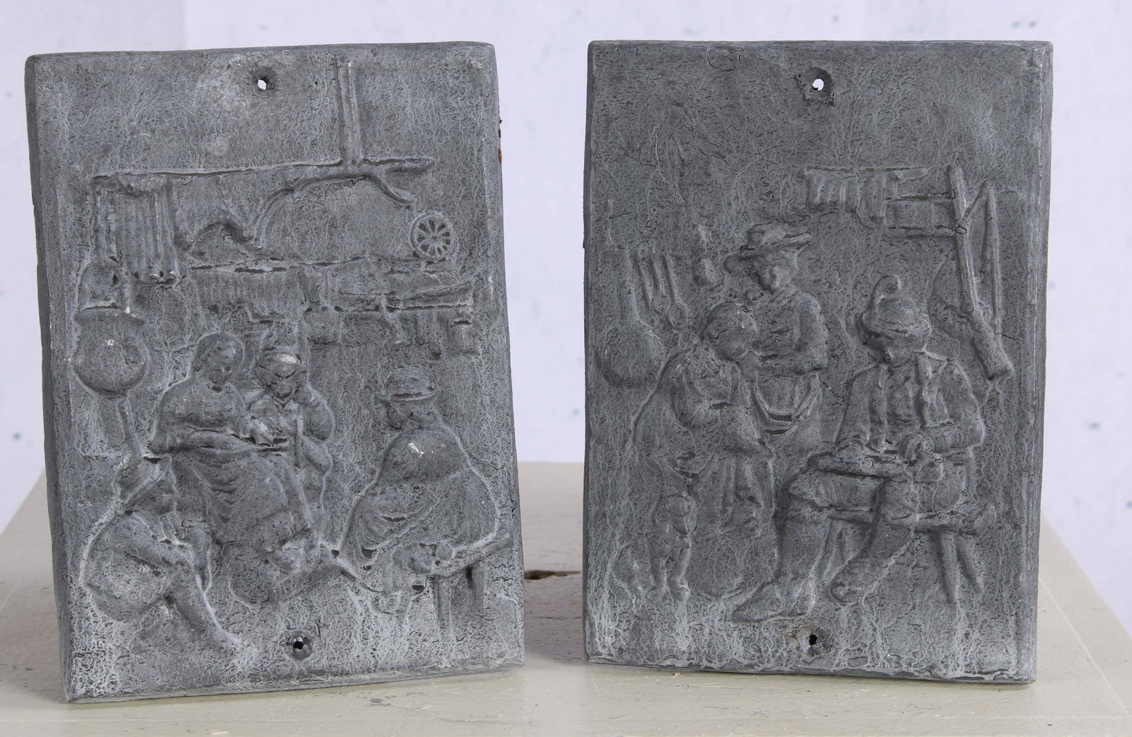 Pair English Cast Lead Genre Scene Appliques: A lot of two cast lead figural plaques. Size: 8"H x 6"W